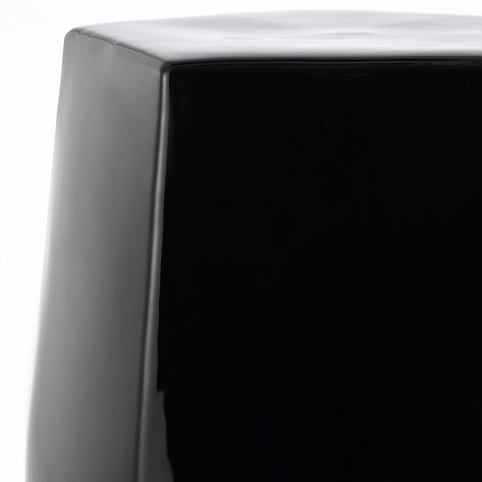 A smooth, rounded edge frames the black ceramic stool's flat top || ACS4596B || detail_studio