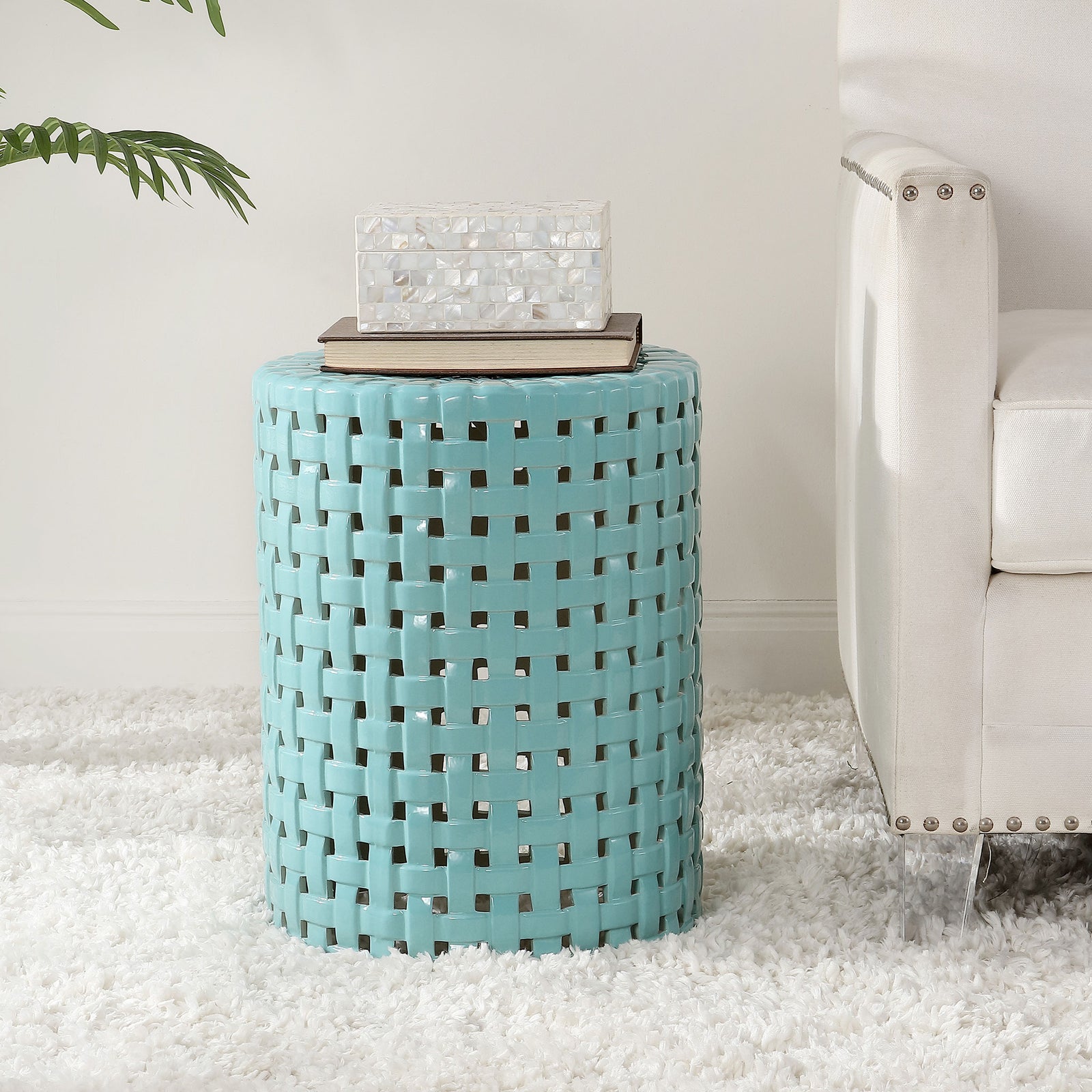 Robin's egg blue ceramic stool adds a bright accent beside a sofa and doubles as a side table || ACS4606B || front_room