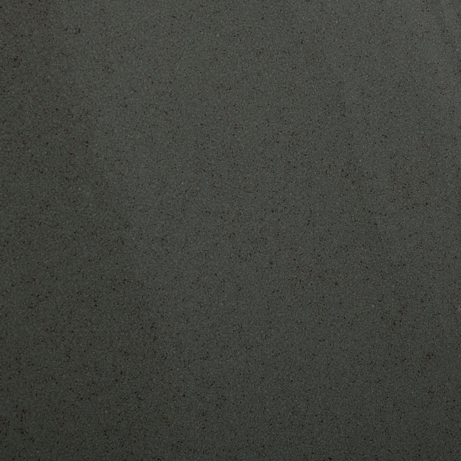 Muted green ceramic has fine, dark speckling beneath a softly lustrous glaze. || ACS4611C || swatch_studio