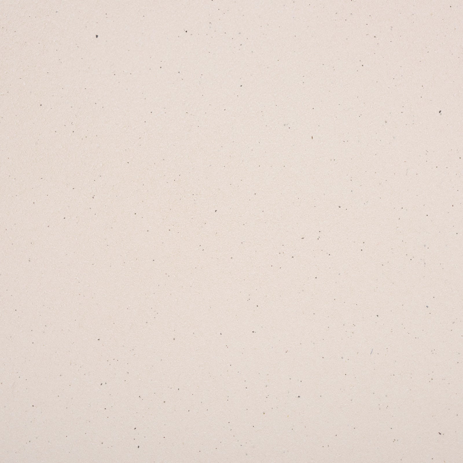 Subtle dark speckles add visual texture to the light cream ceramic finish. || ACS4614A || swatch_studio
