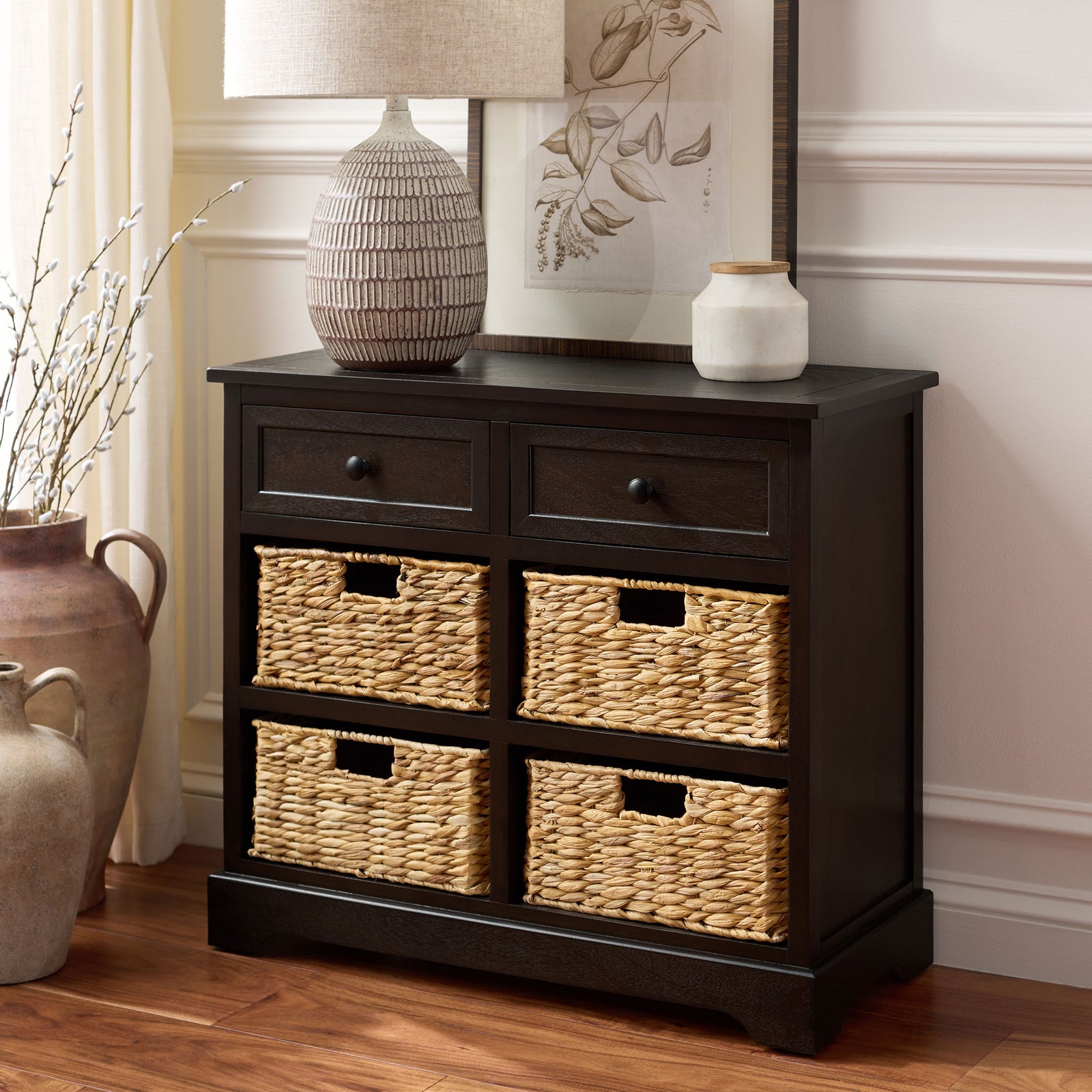 A dark brown storage cabinet balances two drawers with four warm, natural baskets. || AMH5702H || front_angle_room