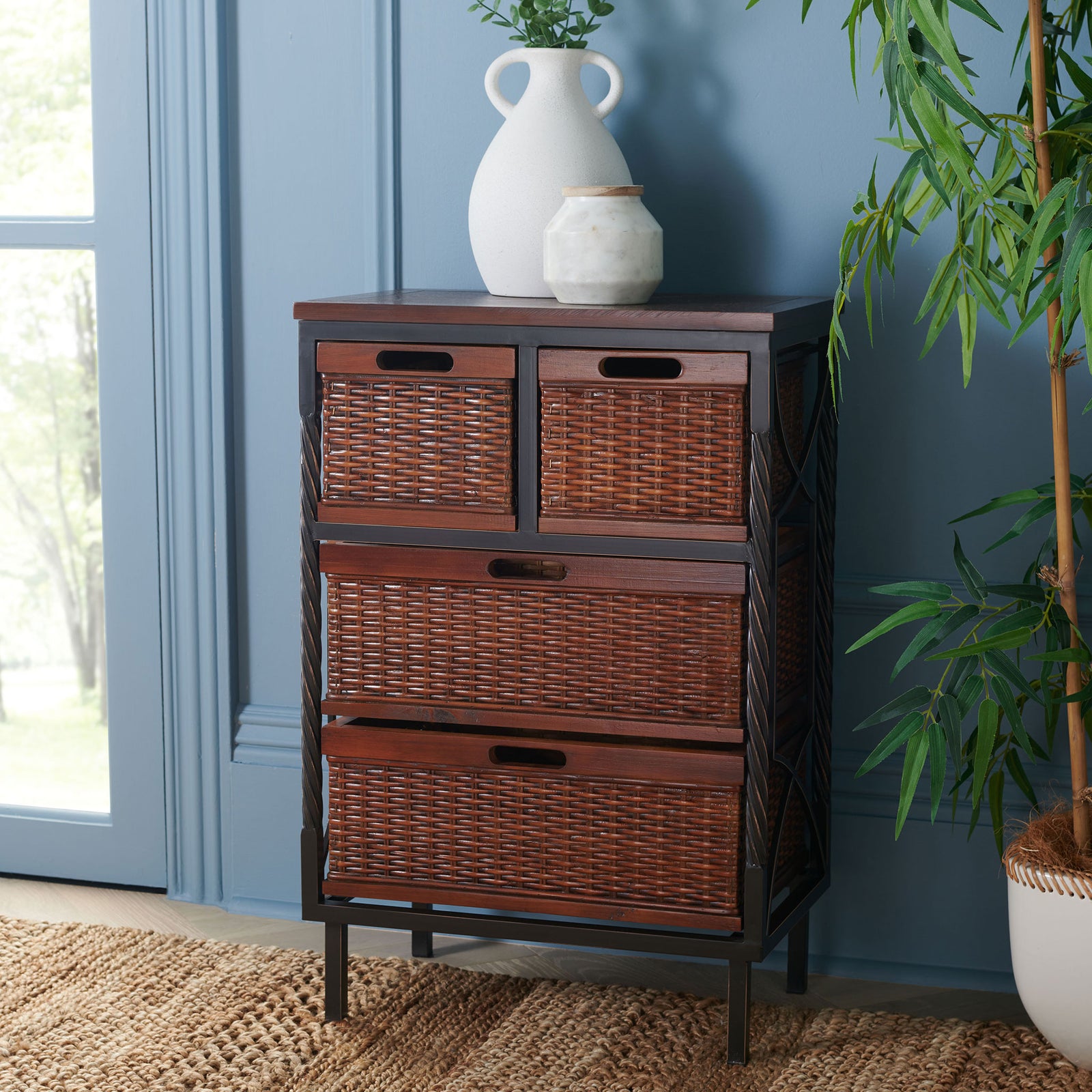 Warm rattan baskets and a dark wood frame add organized storage without overwhelming a room. || AMH6511A || front_angle_room