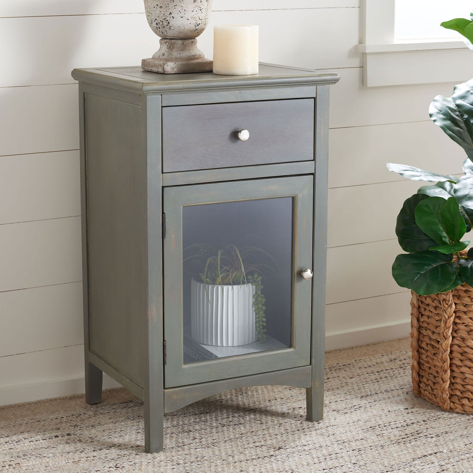 A gray elm nightstand keeps essentials close with a drawer and a glass-front cabinet for display. || AMH6630A || front_angle_room