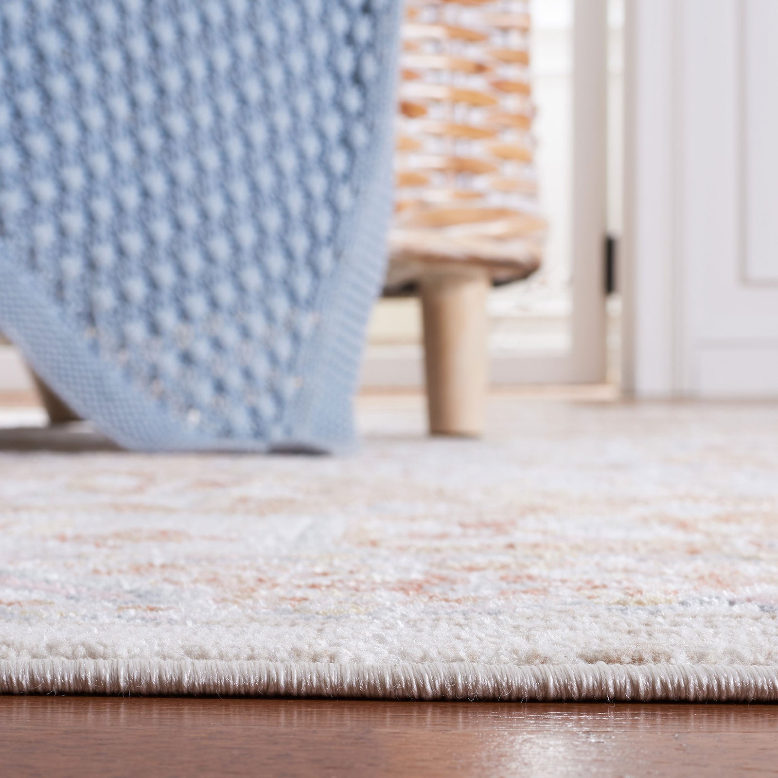 Low-profile edge sits neatly against hardwood floors for easy placement under furniture. || BLR202B-5 || detail_room