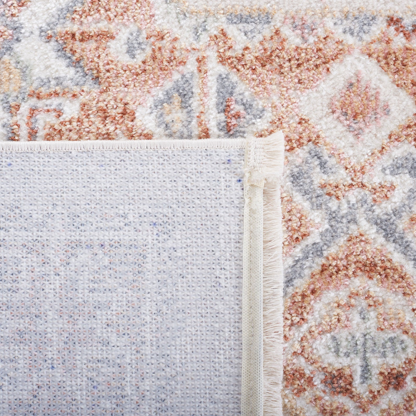 Rug front and underside display a sturdy woven backing and neatly bound edges. || BLR202B-5 || backing_studio