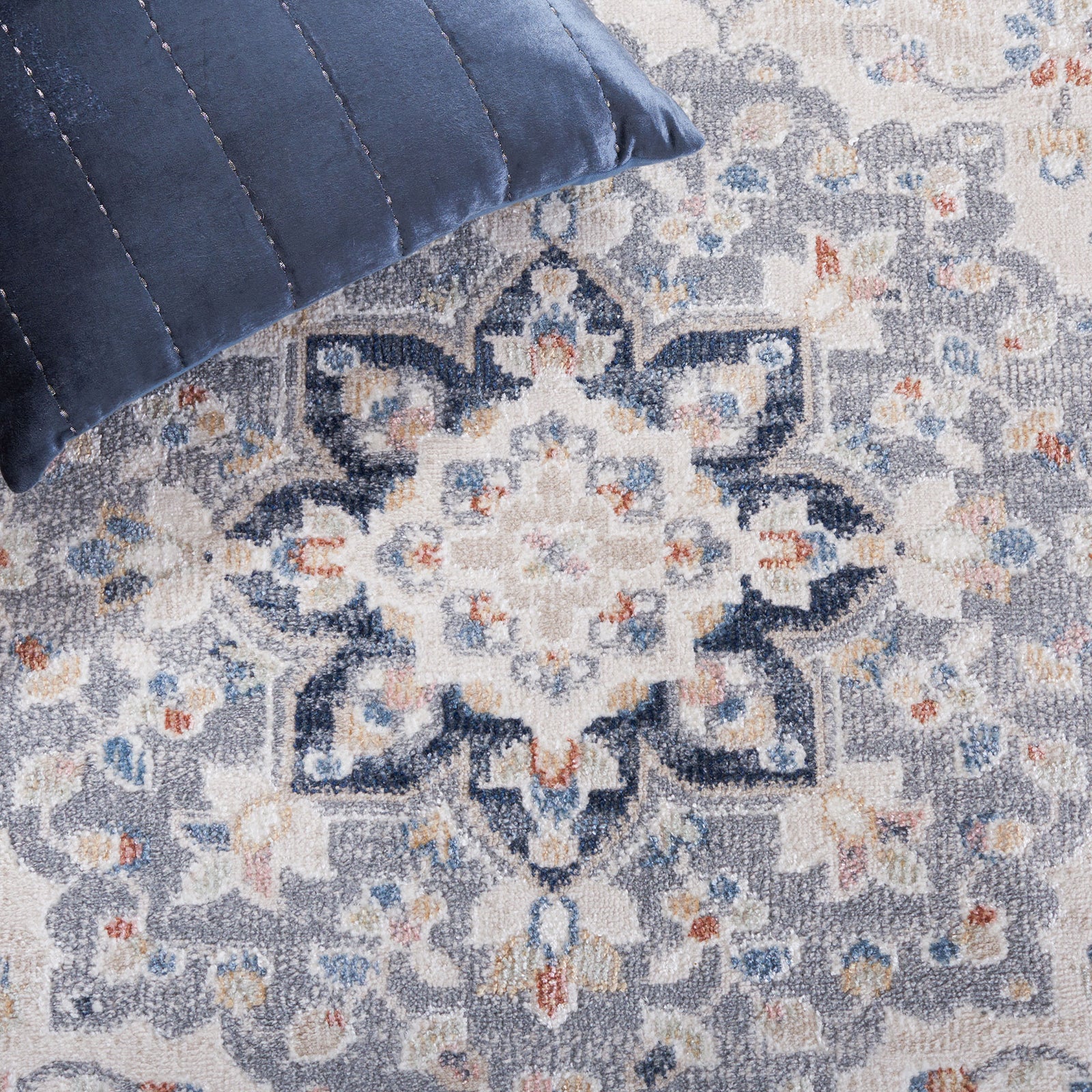 Floral medallion pattern blends navy, gray, and ivory with gently distressed shading || BLR204B-5 || detail_room