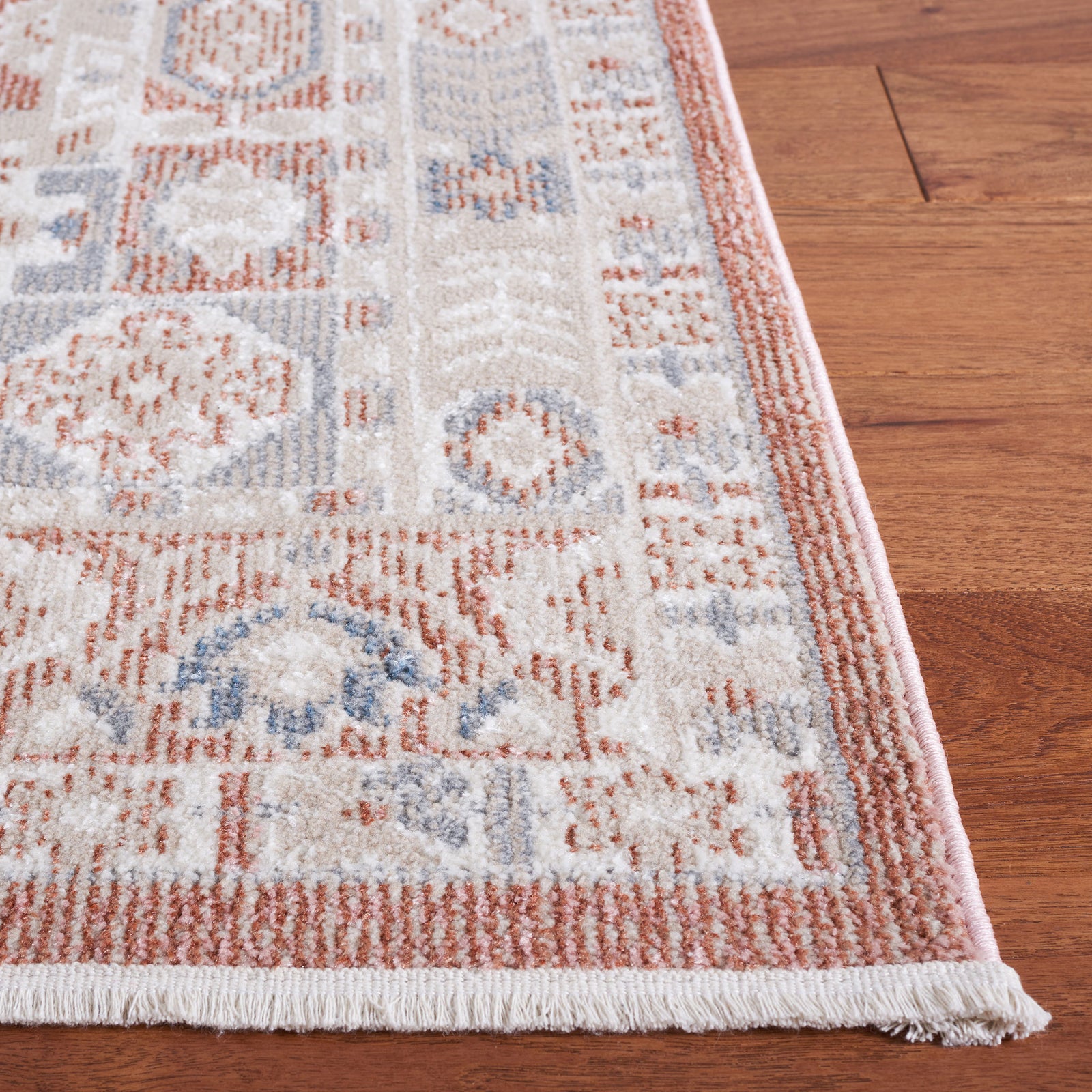 Tasseled edge with pink serging and intricate border, highlighting plush texture and weave || BLR206U-5 || corner_room