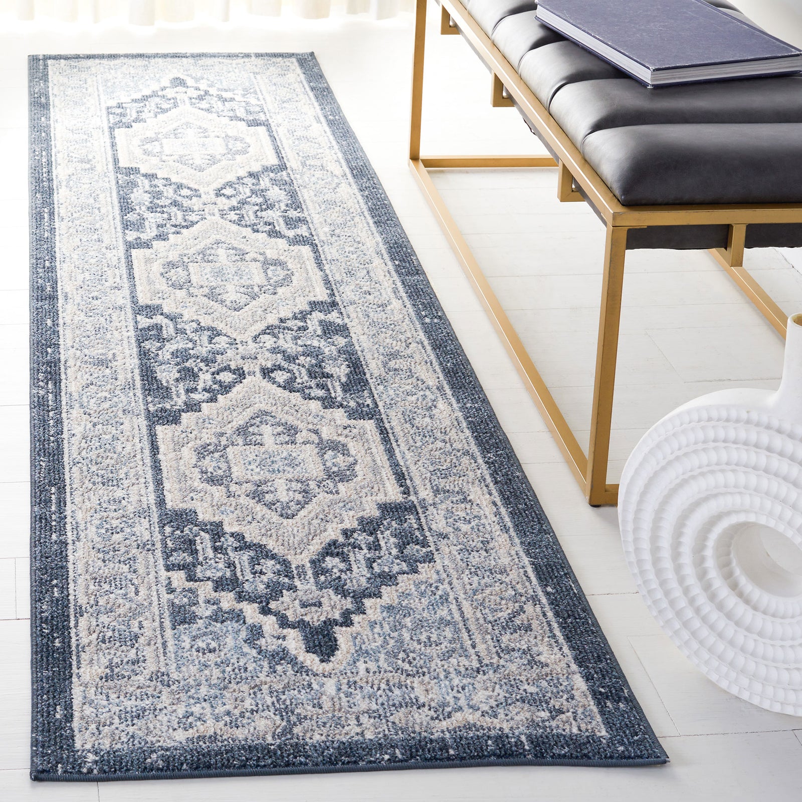 Vintage-style beige and navy runner rug with medallion motifs and a gently faded finish. || BLR210B-28 || top_angle_room