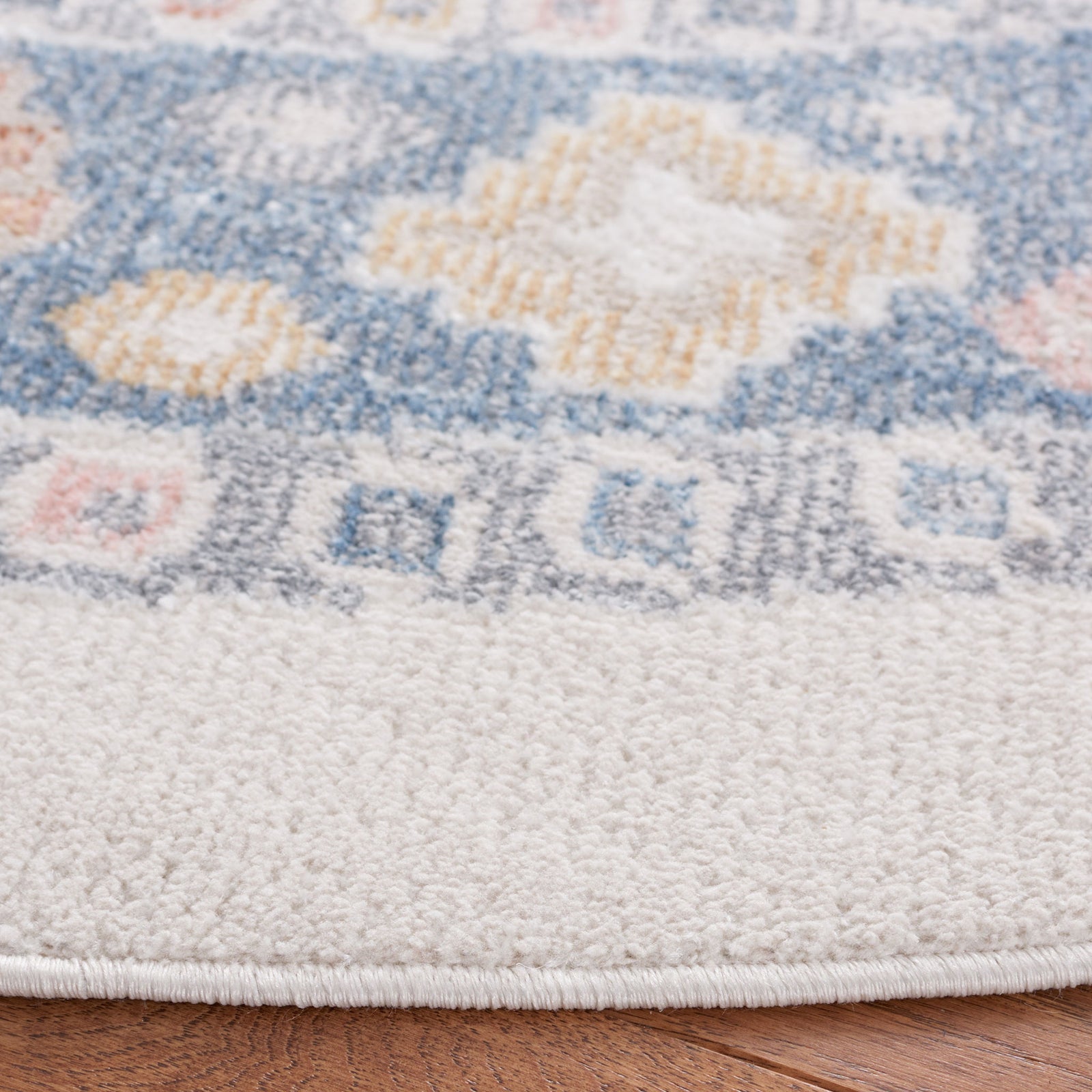 Plush edge and intricate beige and blue motifs with soft, low pile. || BLR218B-7R || detail_room