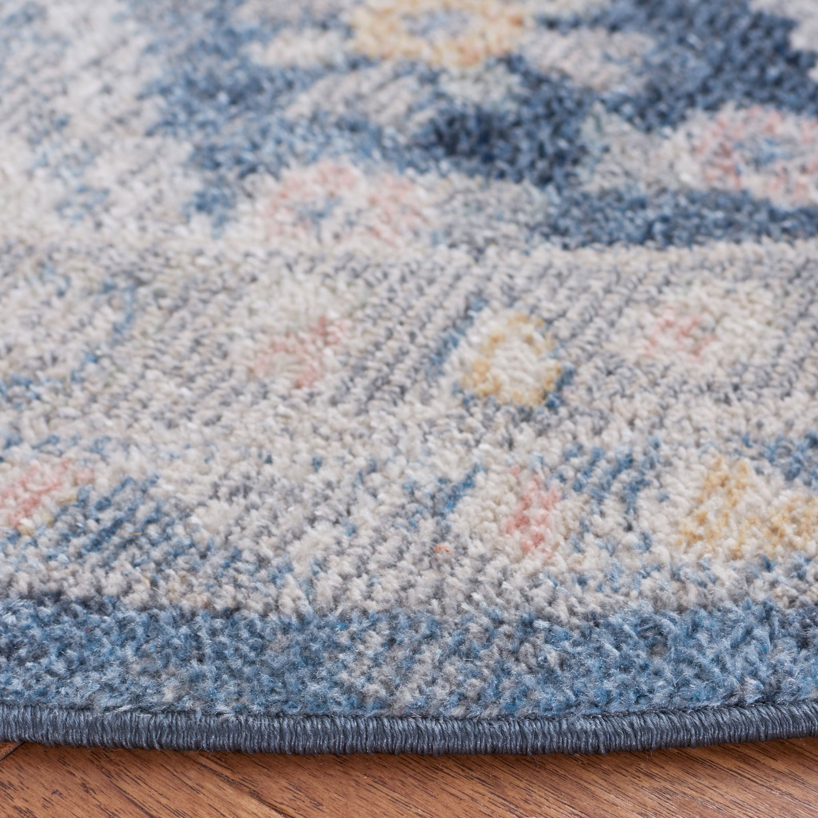 Plush, low-pile texture with a serged blue edge and heathered navy and gray pattern || BLR220F-7R || detail_room