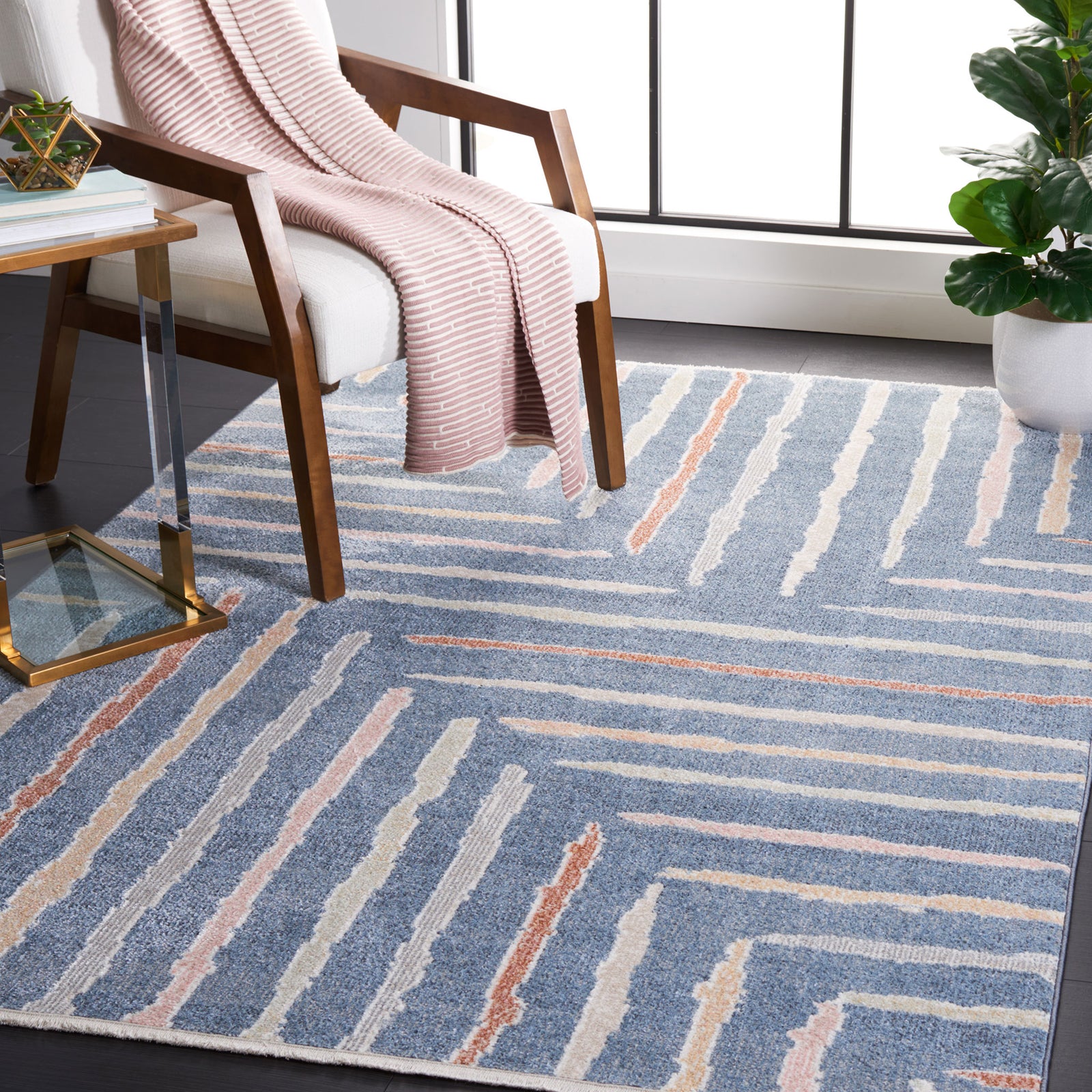 Blue abstract stripe area rug anchoring a bright room with a soft, modern pattern || BLR222M-5 || top_angle_room