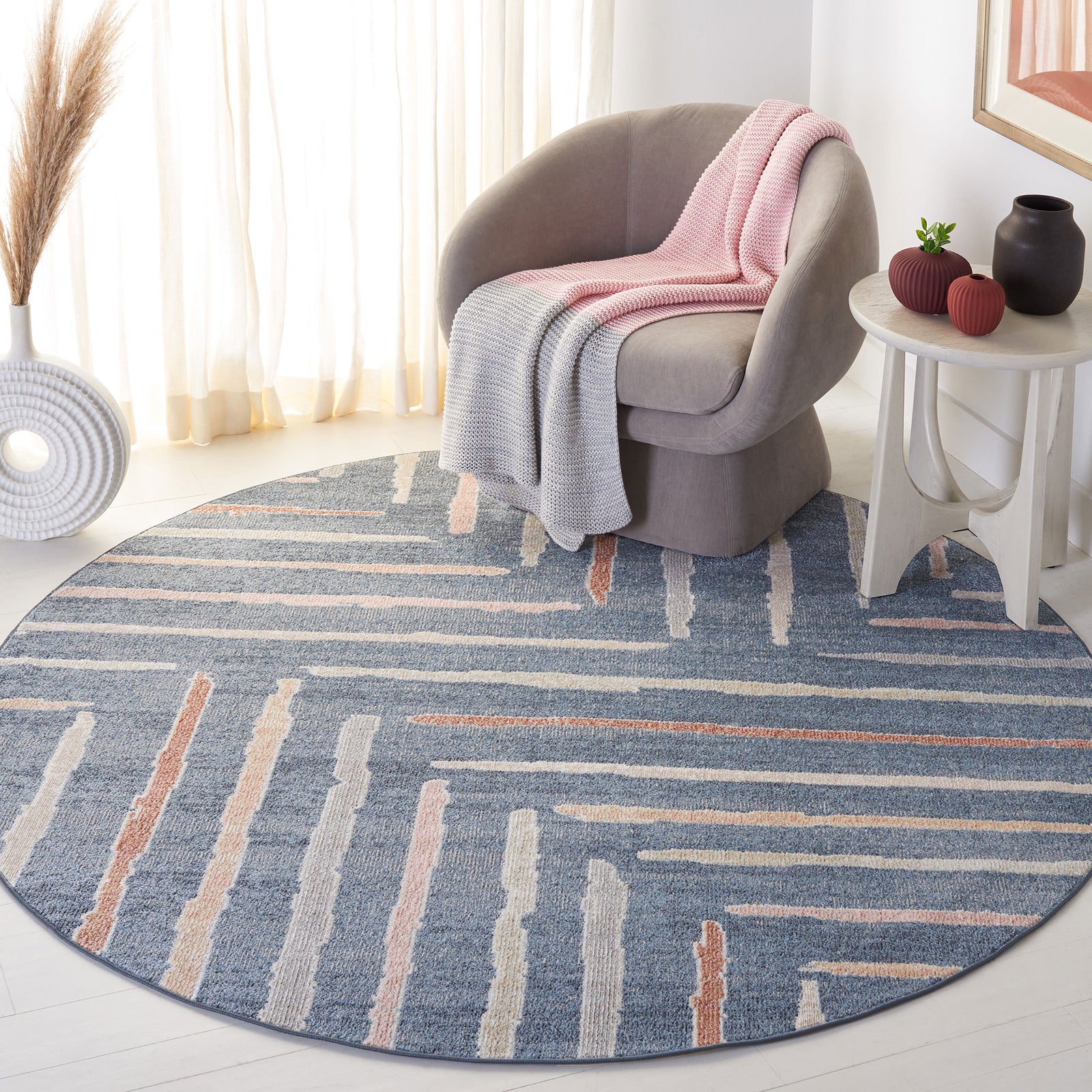 Modern round rug with a blue ground and playful raised stripes that add soft texture || BLR222M-7R || top_angle_room