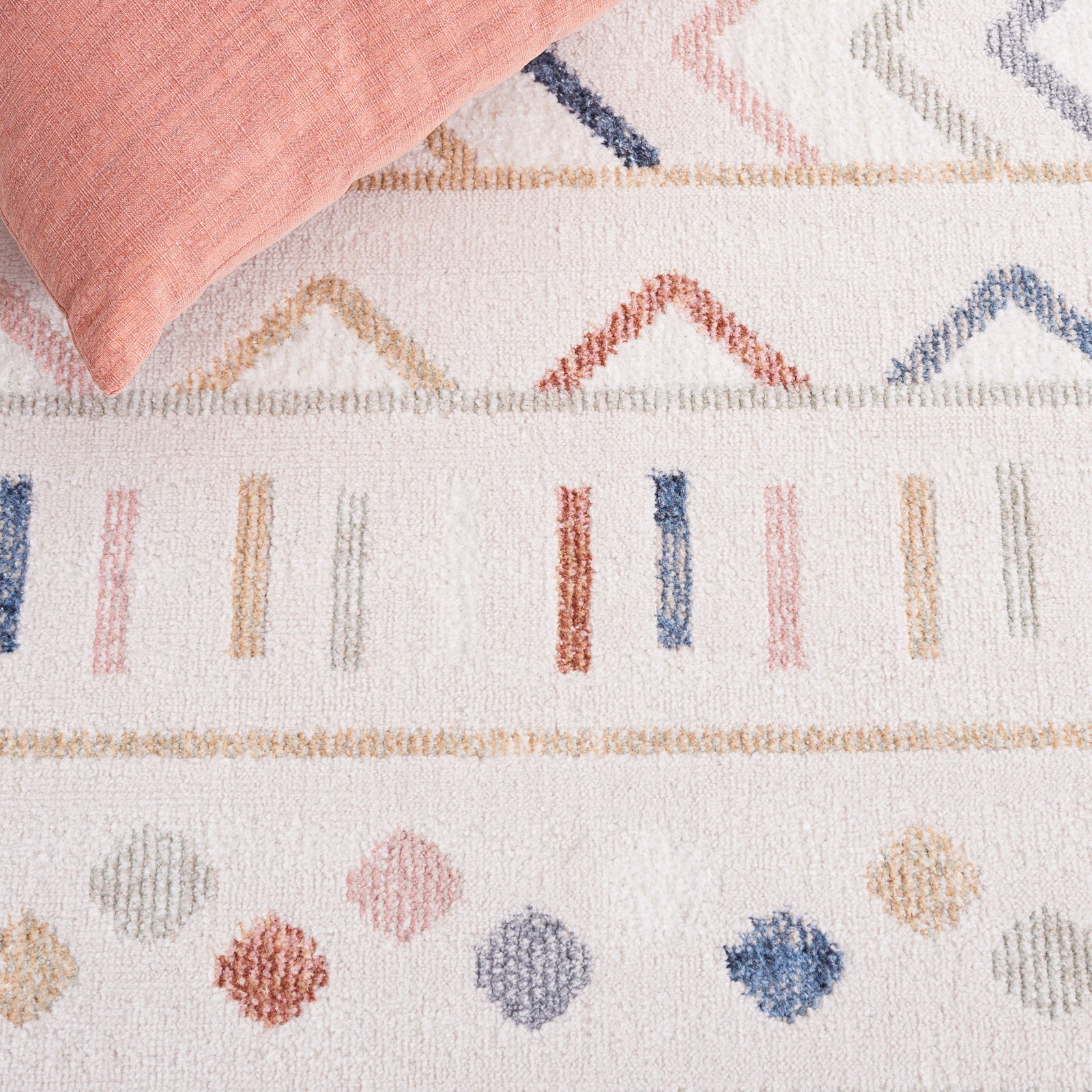Soft blush and blue accents bring subtle color to the geometric design on a warm beige ground || BLR226B-5 || detail_room