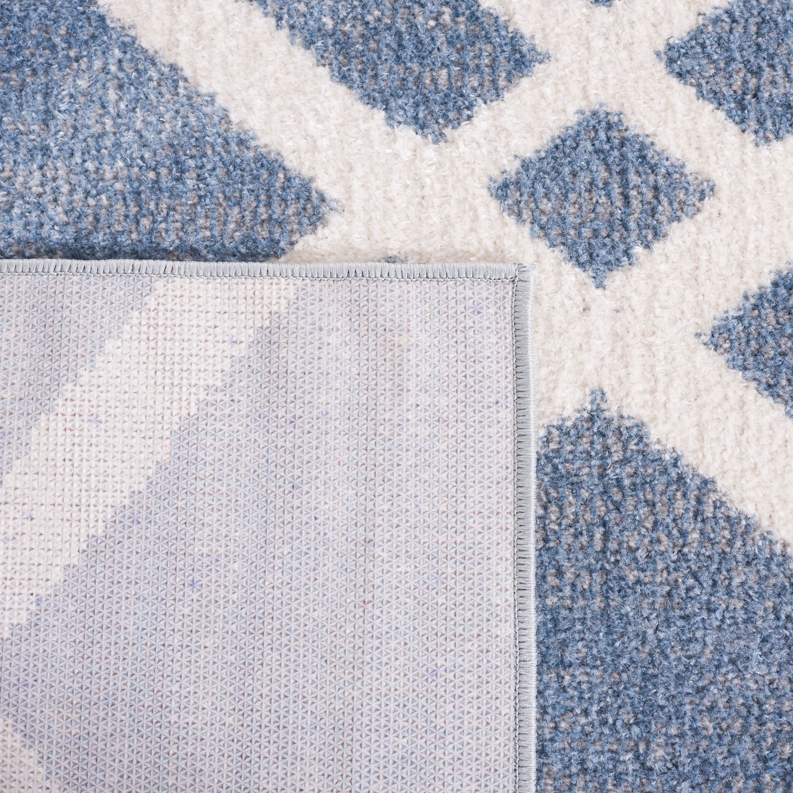 Folded corner reveals durable backing and neatly finished edging. || BLR228M-5 || backing_studio
