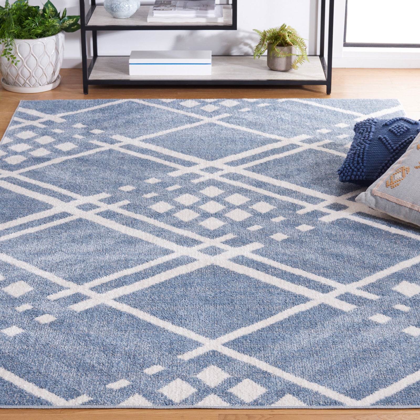 Modern blue and ivory lattice rug elevates the living area with plush texture and clean edges. || BLR228M-5 || front_angle_room