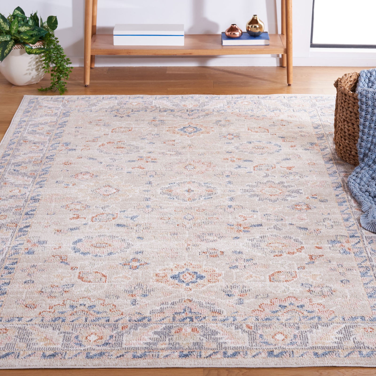 Traditional beige rug with blue and rust motifs and a gently distressed, timeworn finish. || BLR232B-5 || front_angle_room