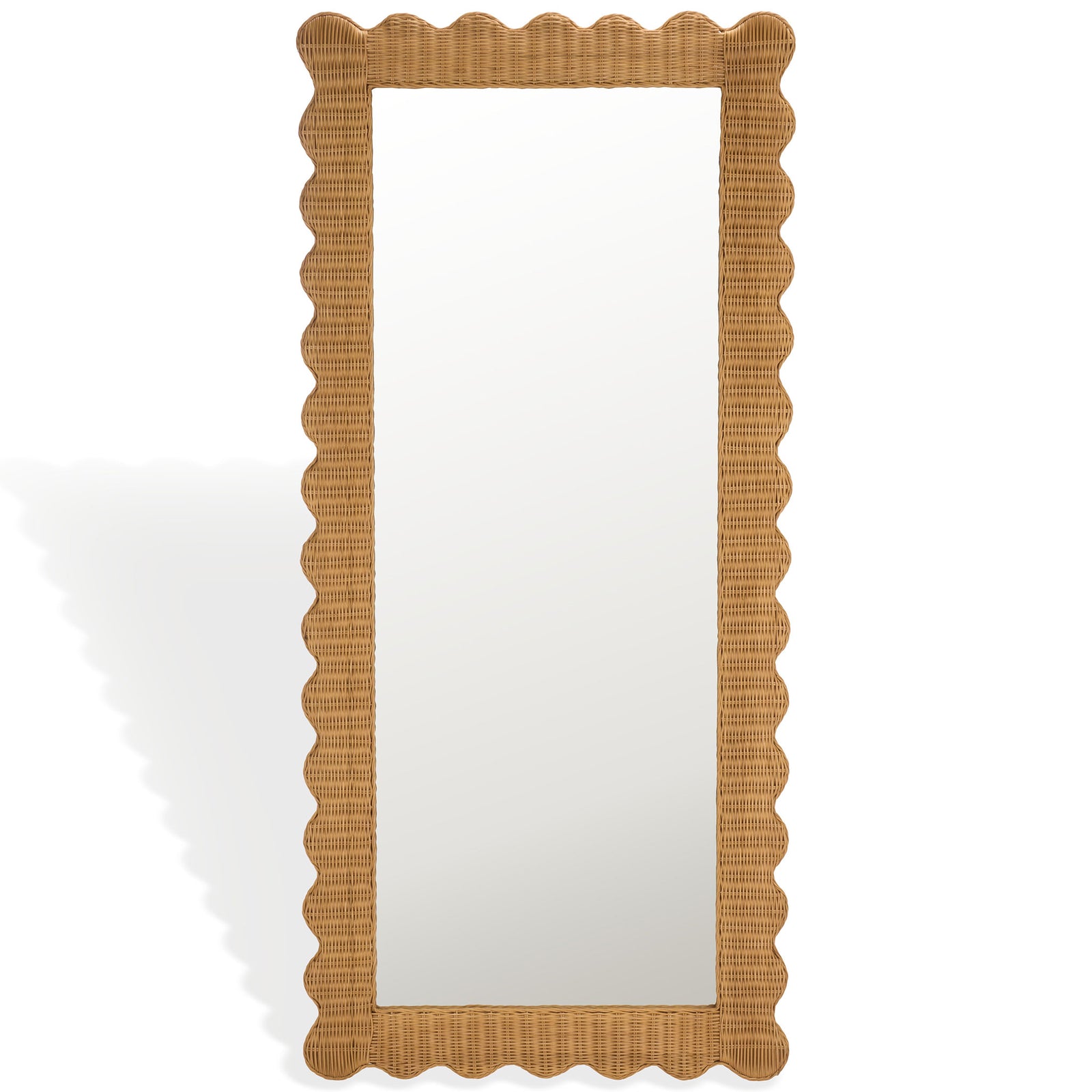A tall rectangular mirror is bordered by woven natural rattan and playful scalloped edges. || CWK3021A || front_studio