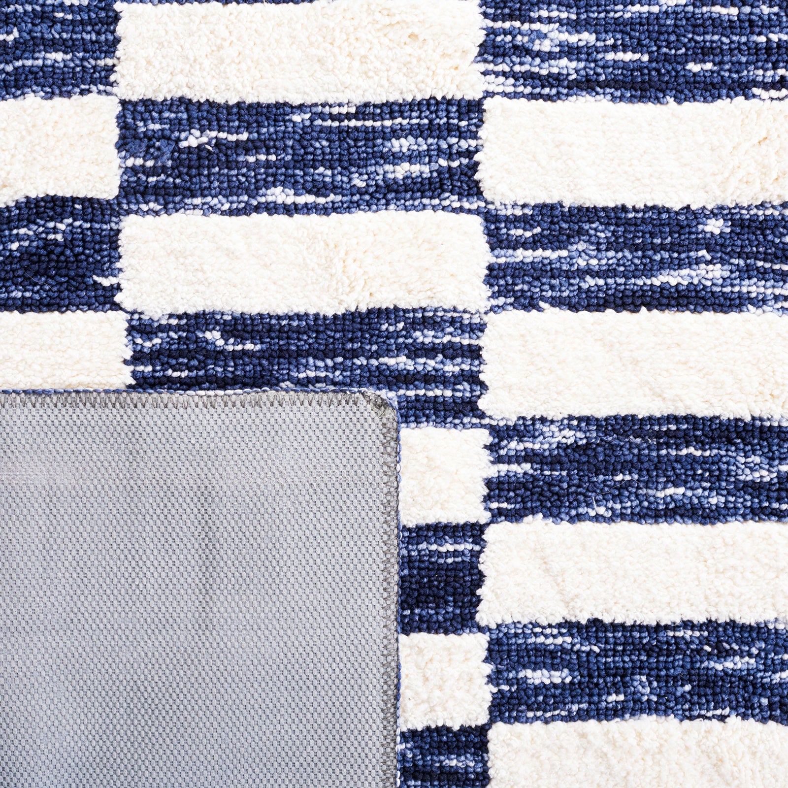 Navy and ivory weave with gray latex backing and neatly finished edges || ECR109N-5 || backing_studio