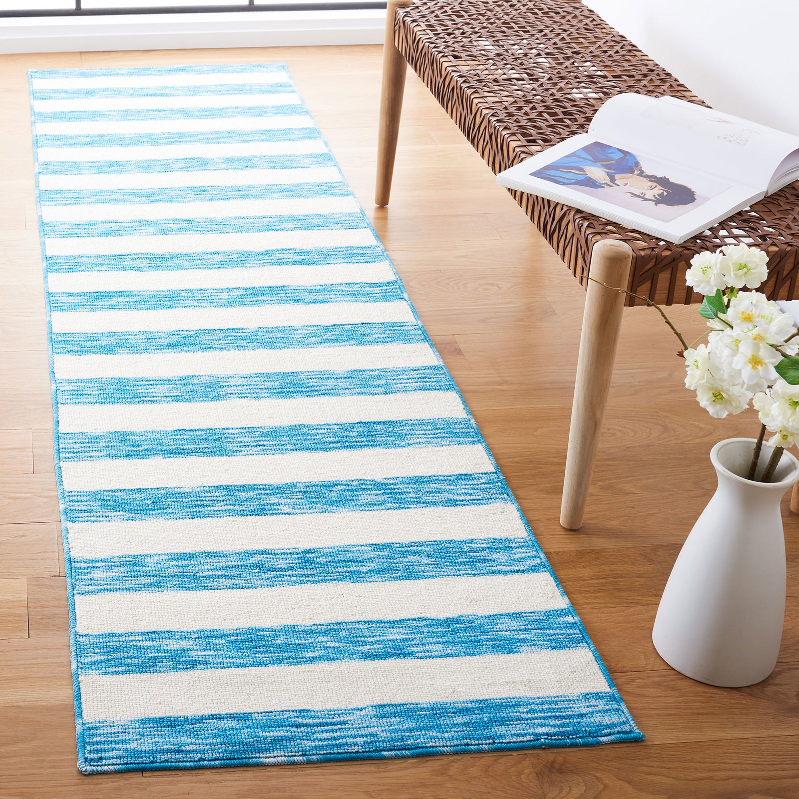 Blue and ivory striped runner rug adds crisp coastal style with bright bands and durable flatweave texture || ECR115M-28 || top_angle_room