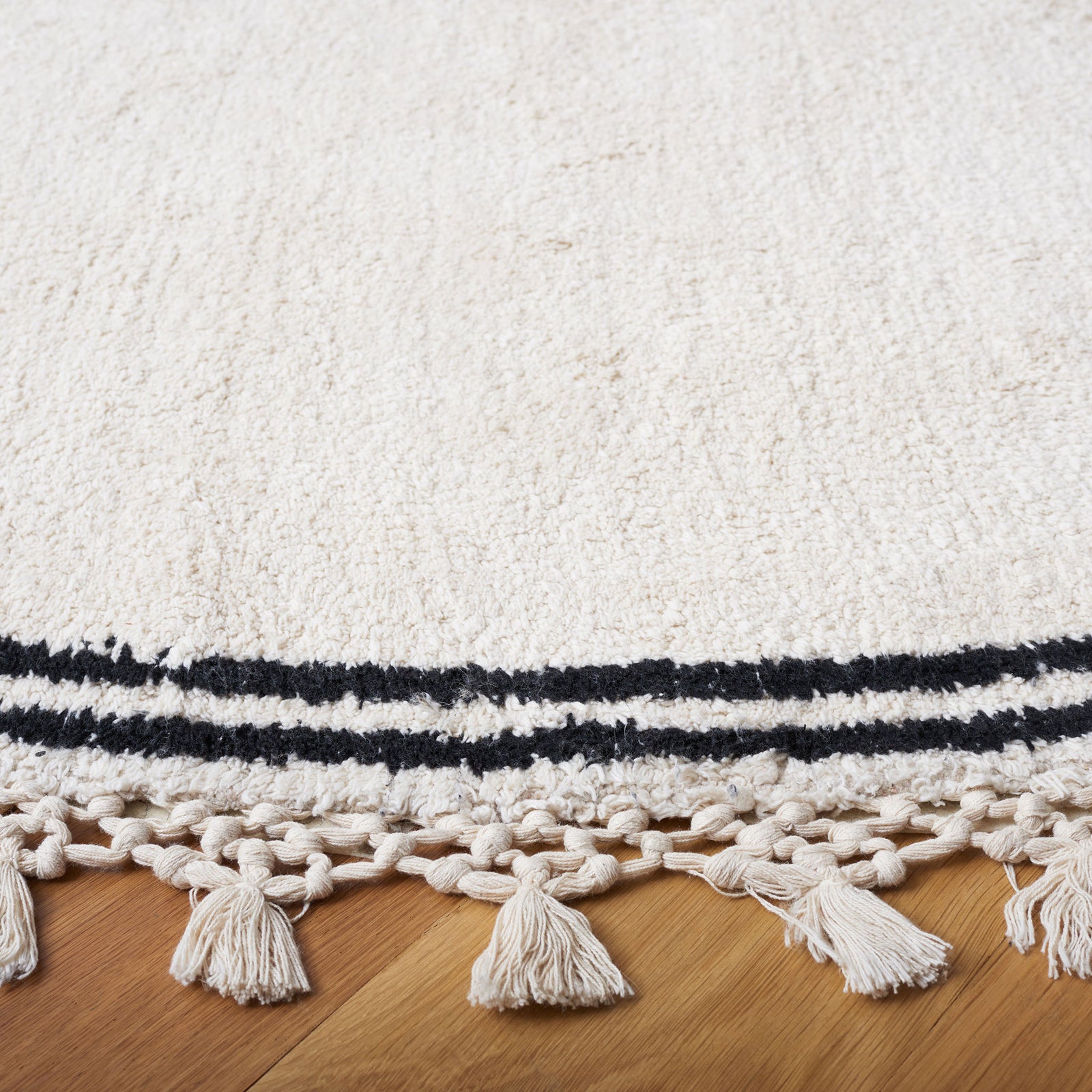 Handwoven texture with braided edge, tassel fringe, and contrast double stripe || ECR201A-6R || detail_room