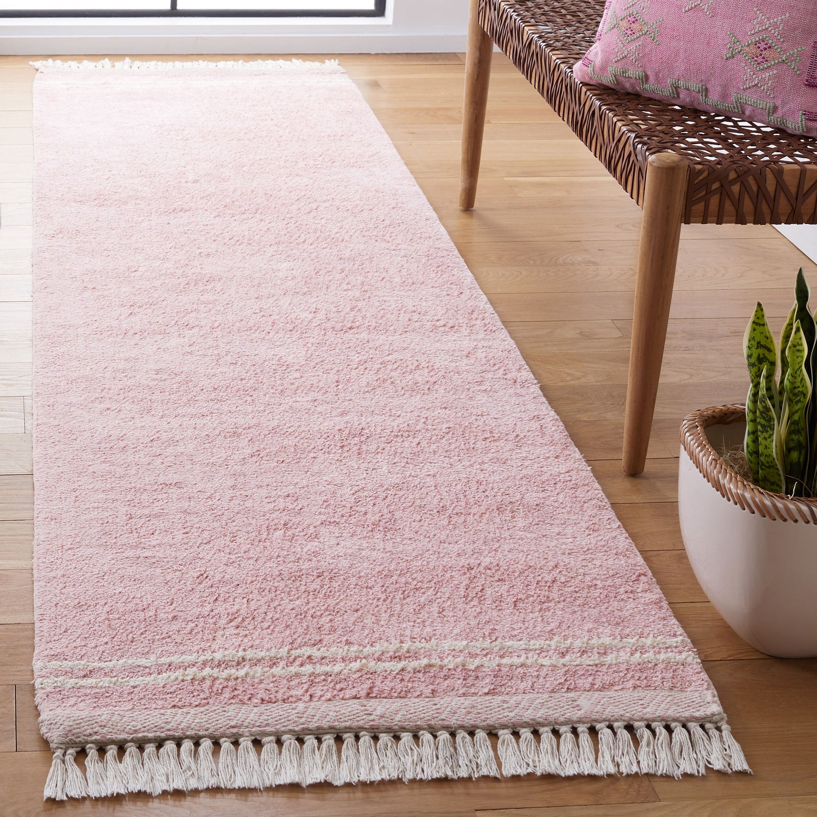 Blush pink runner with ivory tassel fringe that adds a light, cozy touch to modern decor || ECR211U-29 || front_angle_room