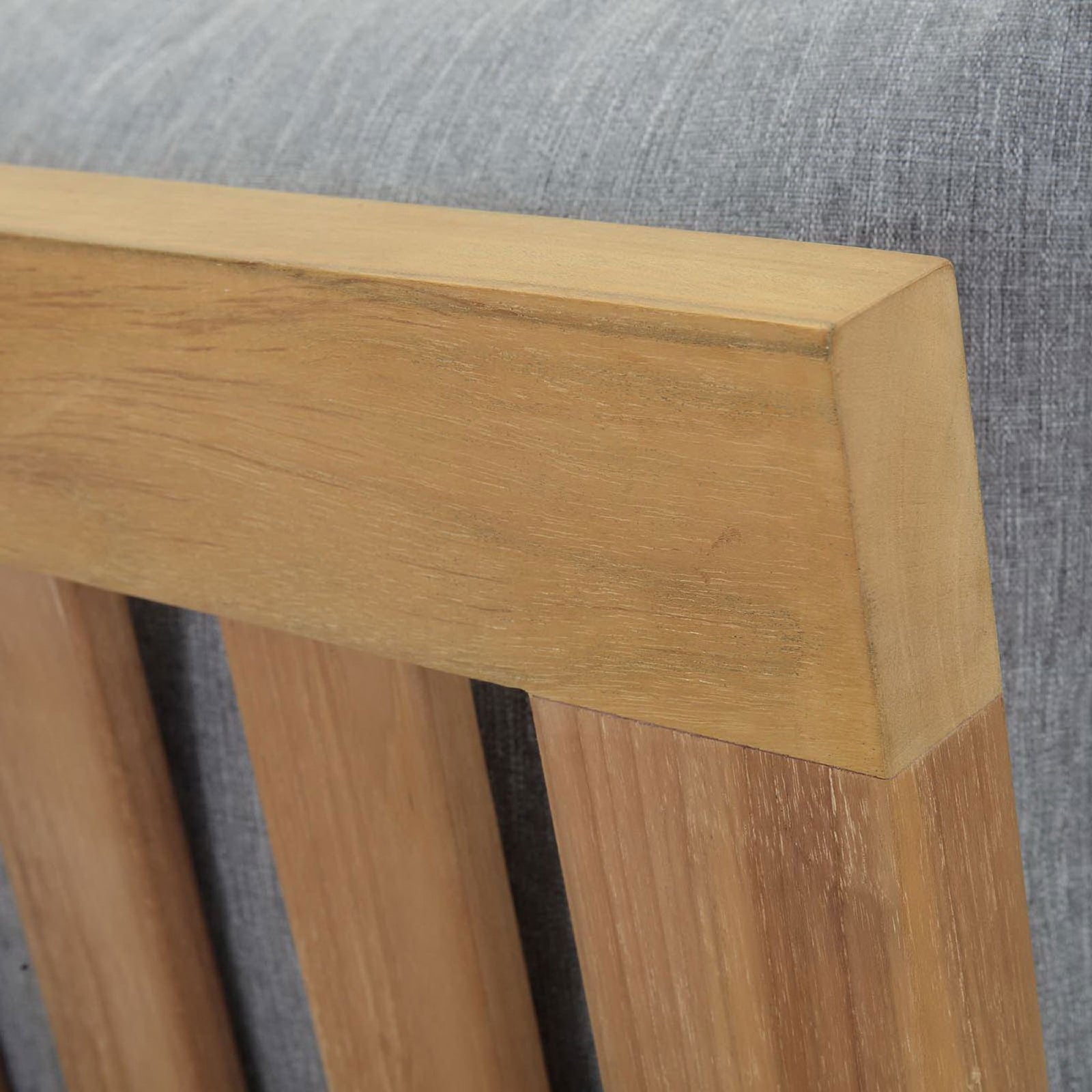 Smooth, clean-lined teak backrest detail set against soft gray upholstery || EEI-1150-NAT-GRY-SET || detail_studio