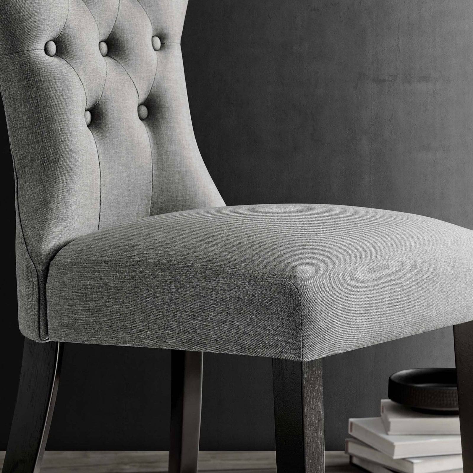 Light gray dining chair seat and lower back with soft woven texture beside dark wood legs || EEI-1380-LGR || detail_room