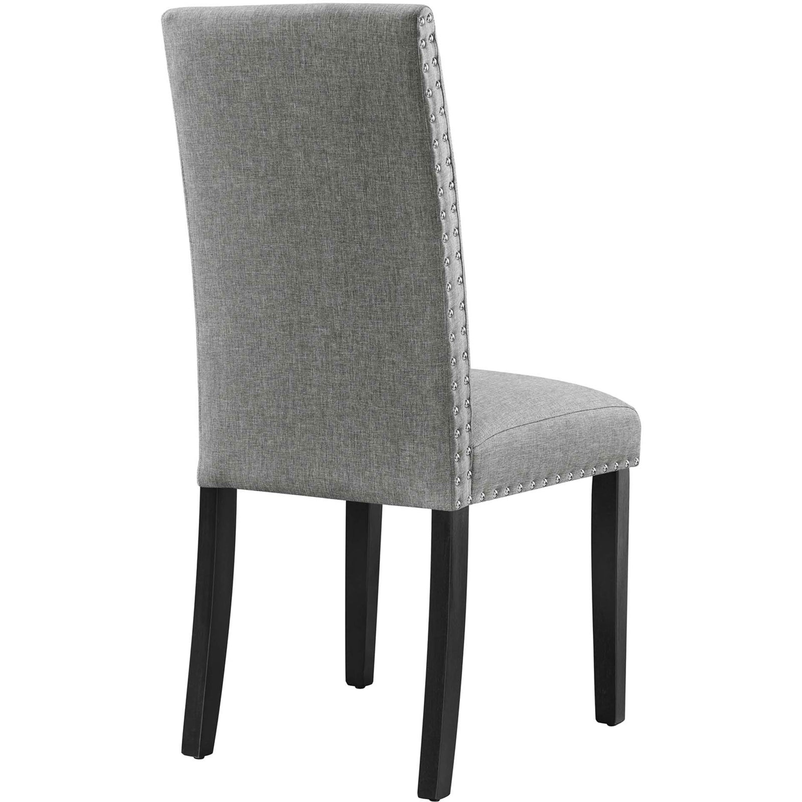 Light gray dining chair with smooth upholstered back, nailhead trim, and dark wood legs. || EEI-1384-LGR || back_angle_studio