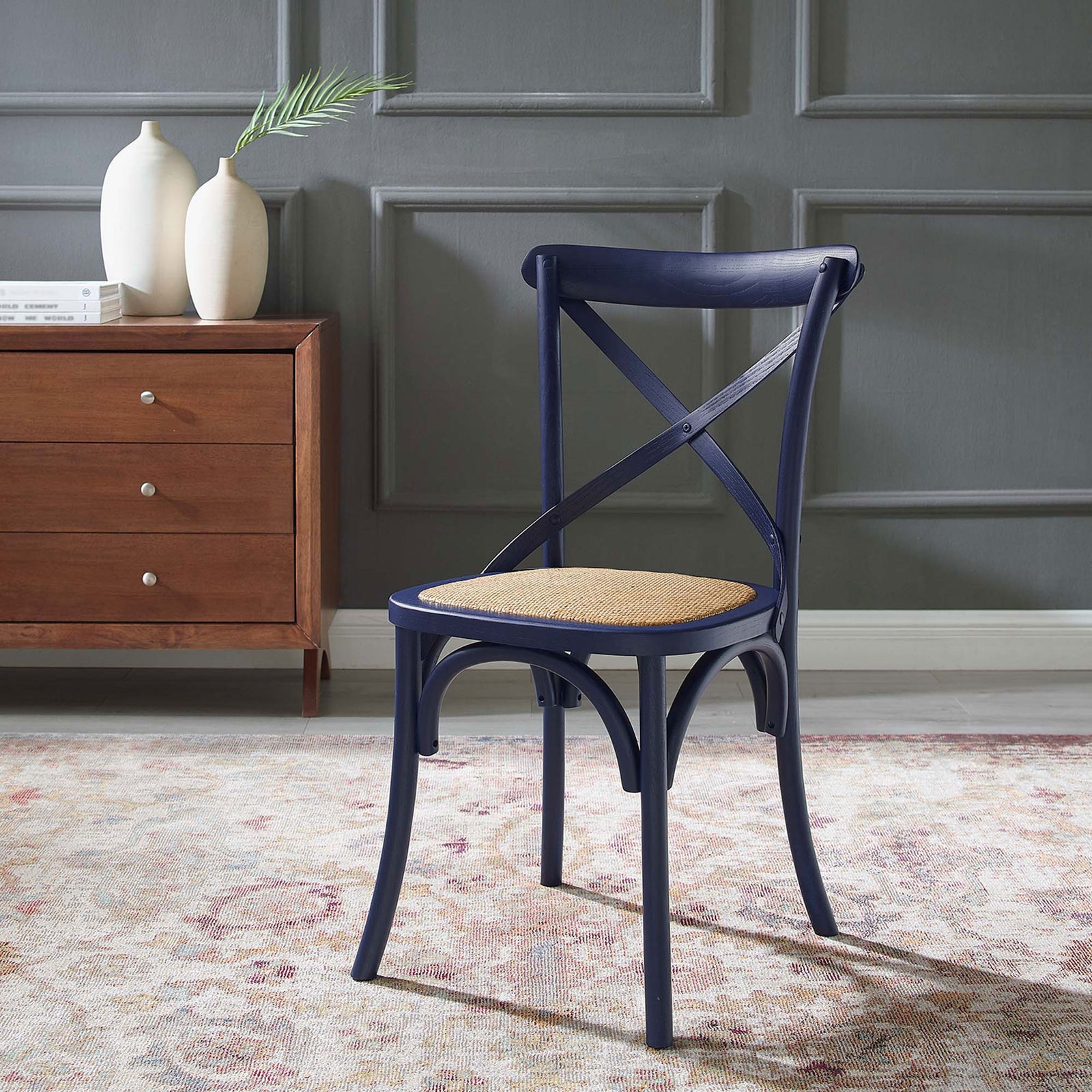 Midnight blue farmhouse dining chair with rattan seat styled in a cozy living space. || EEI-1541-MID || front_angle_room