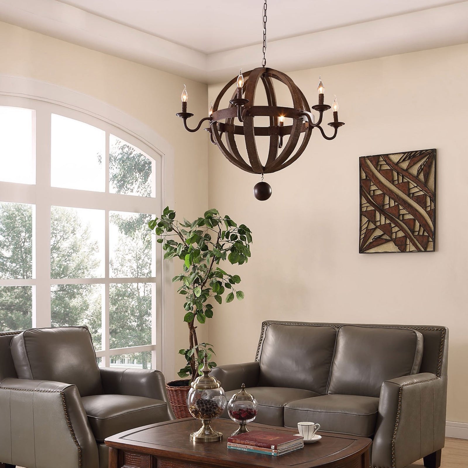 Chandelier warms a cozy living room with six glowing lights and a rustic wood ringed frame || EEI-1569 || front_on_room