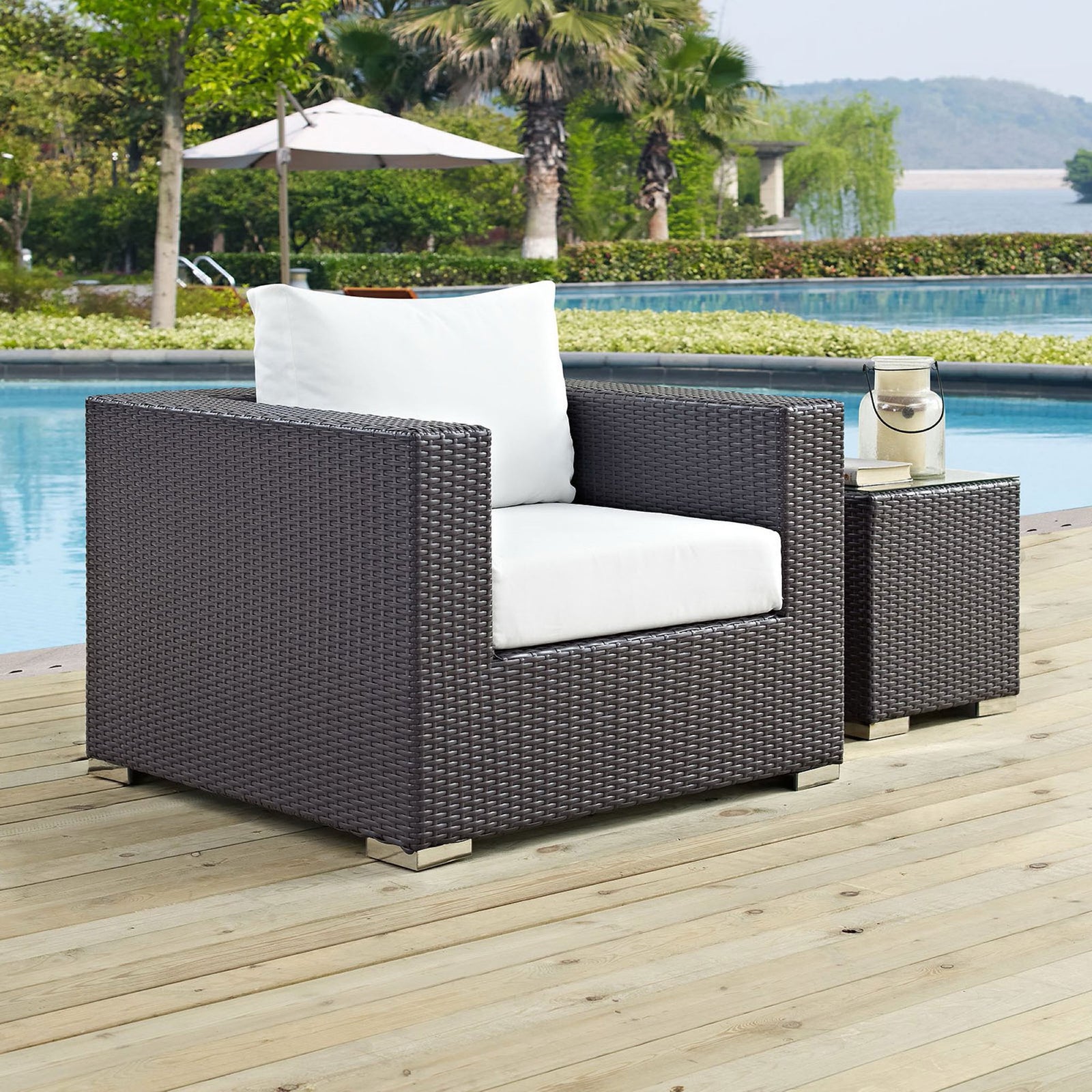 Espresso wicker armchair with white cushions styled by a pool with matching side table || EEI-1906-EXP-WHI || front_angle_room