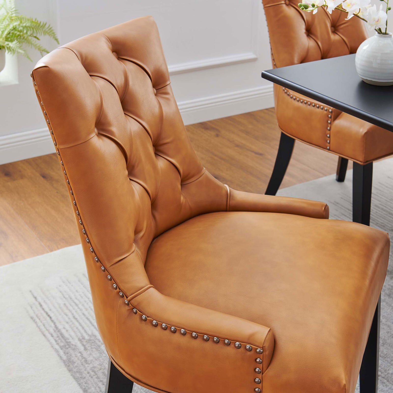 Tan tufted vegan leather dining chair styled in a bright dining room with coordinating pieces || EEI-2222-TAN || detail_room