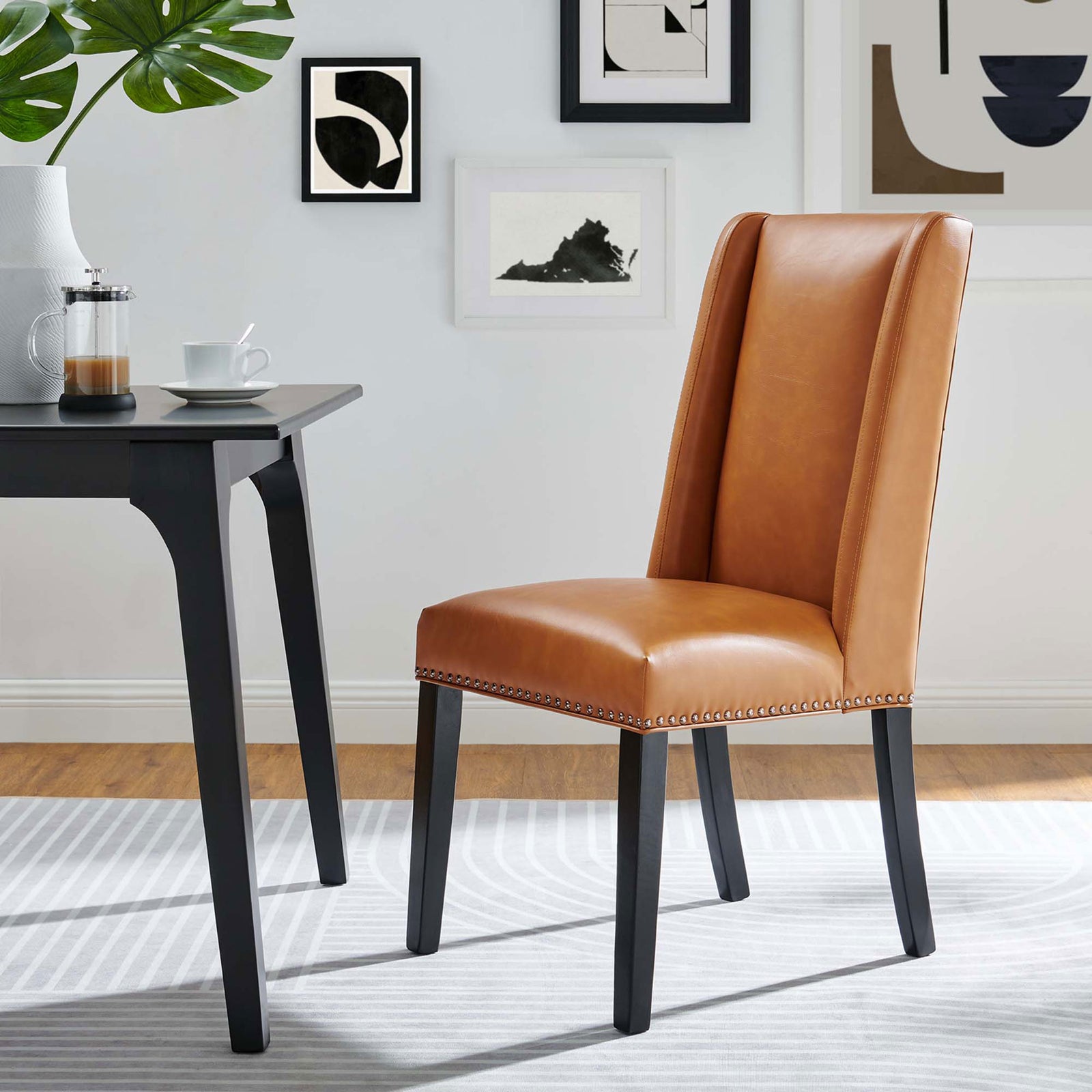 Tan vegan leather dining chair adds warm contrast and modern style to this light, airy dining room. || EEI-2232-TAN || front_angle_room