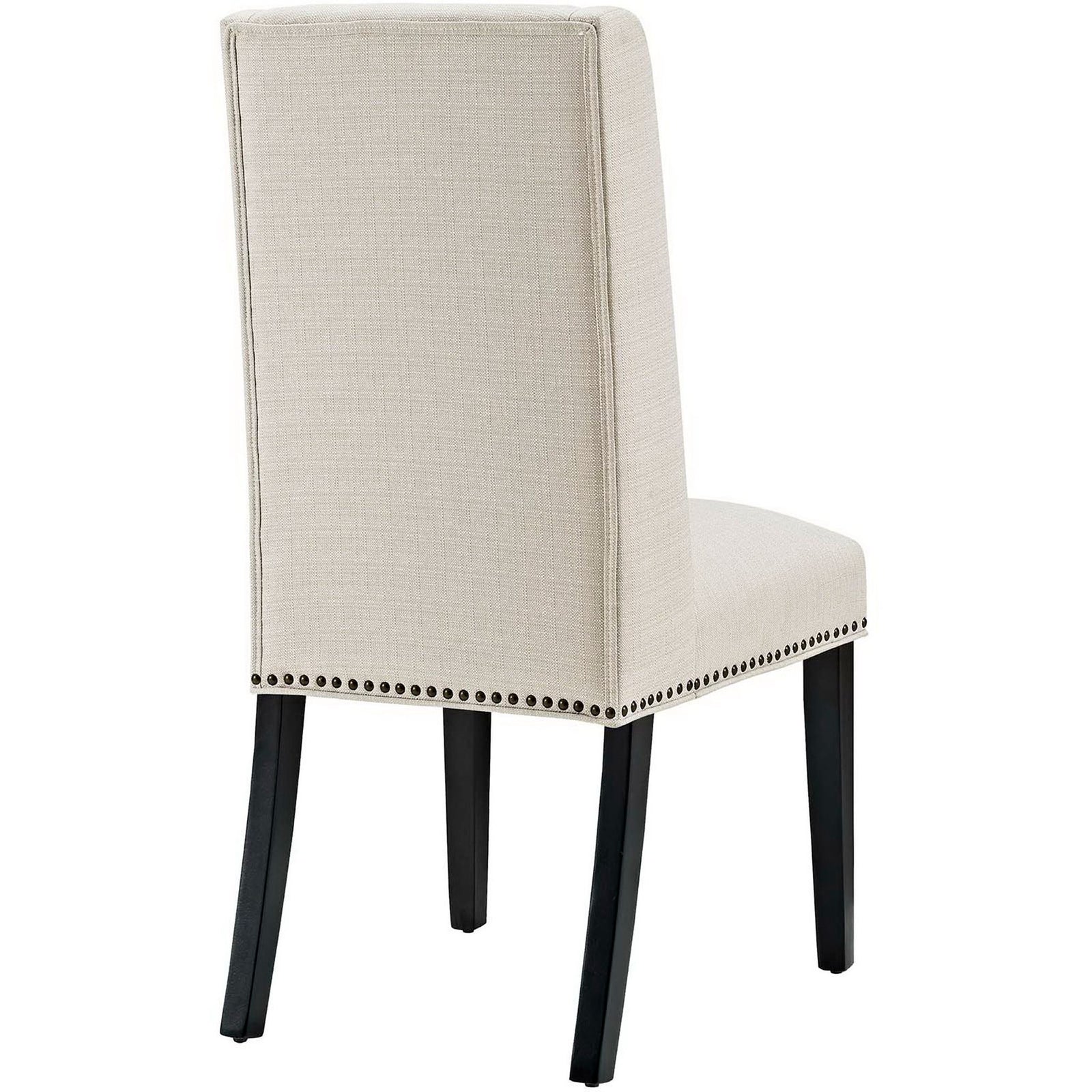 Beige fabric dining chair with smooth high backrest, nailhead border, and slim tapered legs. || EEI-2233-BEI || back_angle_studio