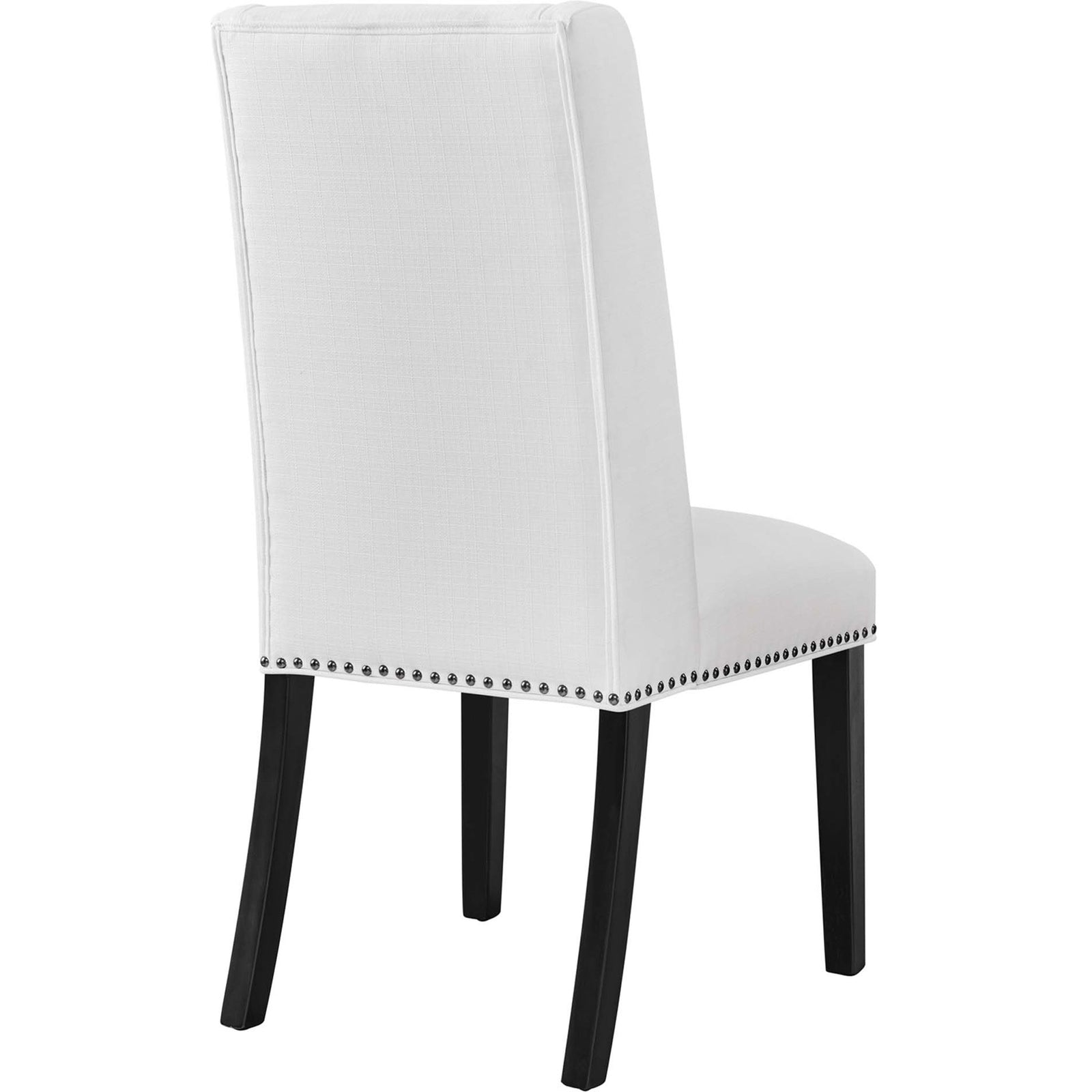 Back of white wingback dining chair with smooth upholstery and slim black legs || EEI-2233-WHI || back_angle_studio