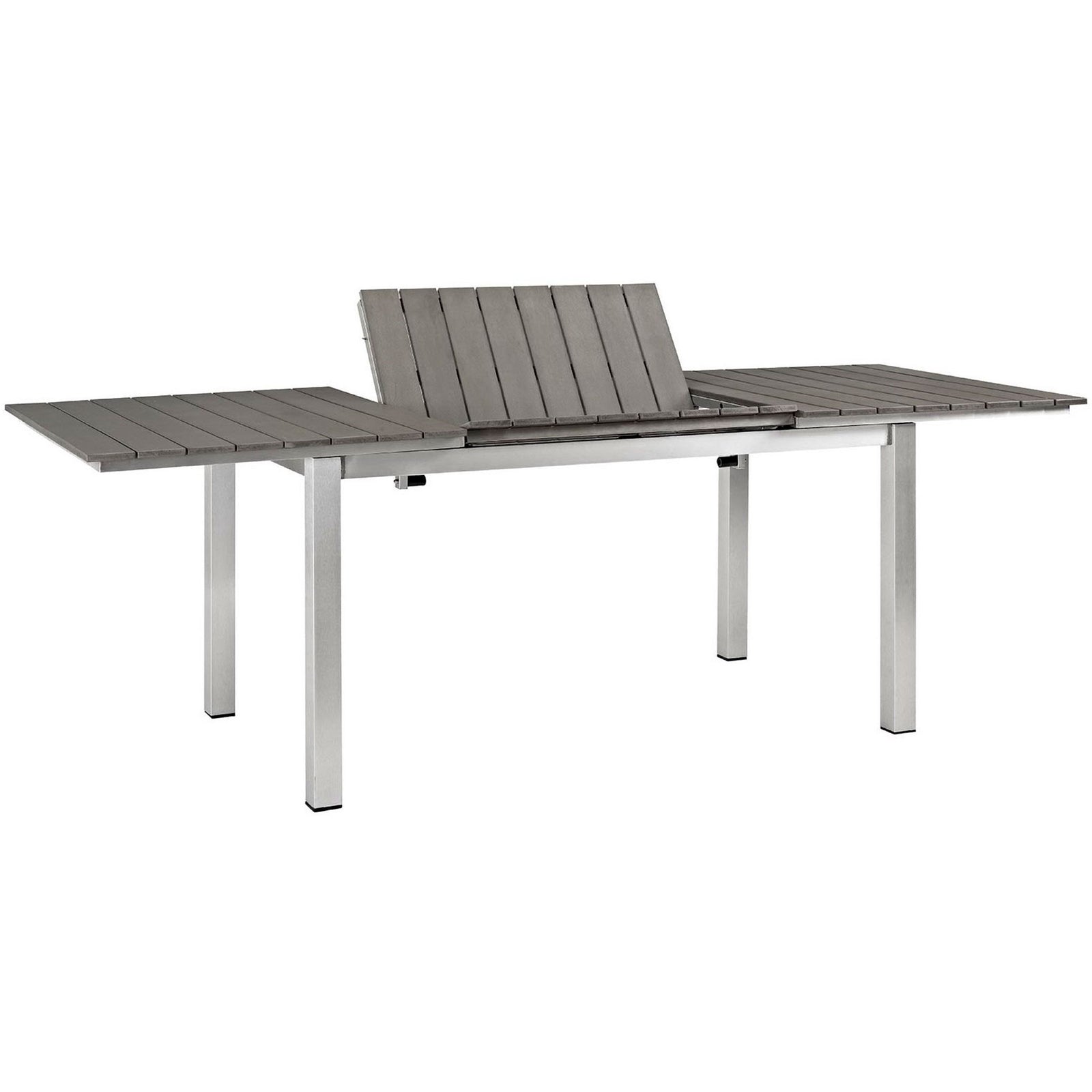 Outdoor extension dining table displaying its lift-up center leaf and smooth gray slatted surface || EEI-2257-SLV-GRY || front_angle_converted_studio
