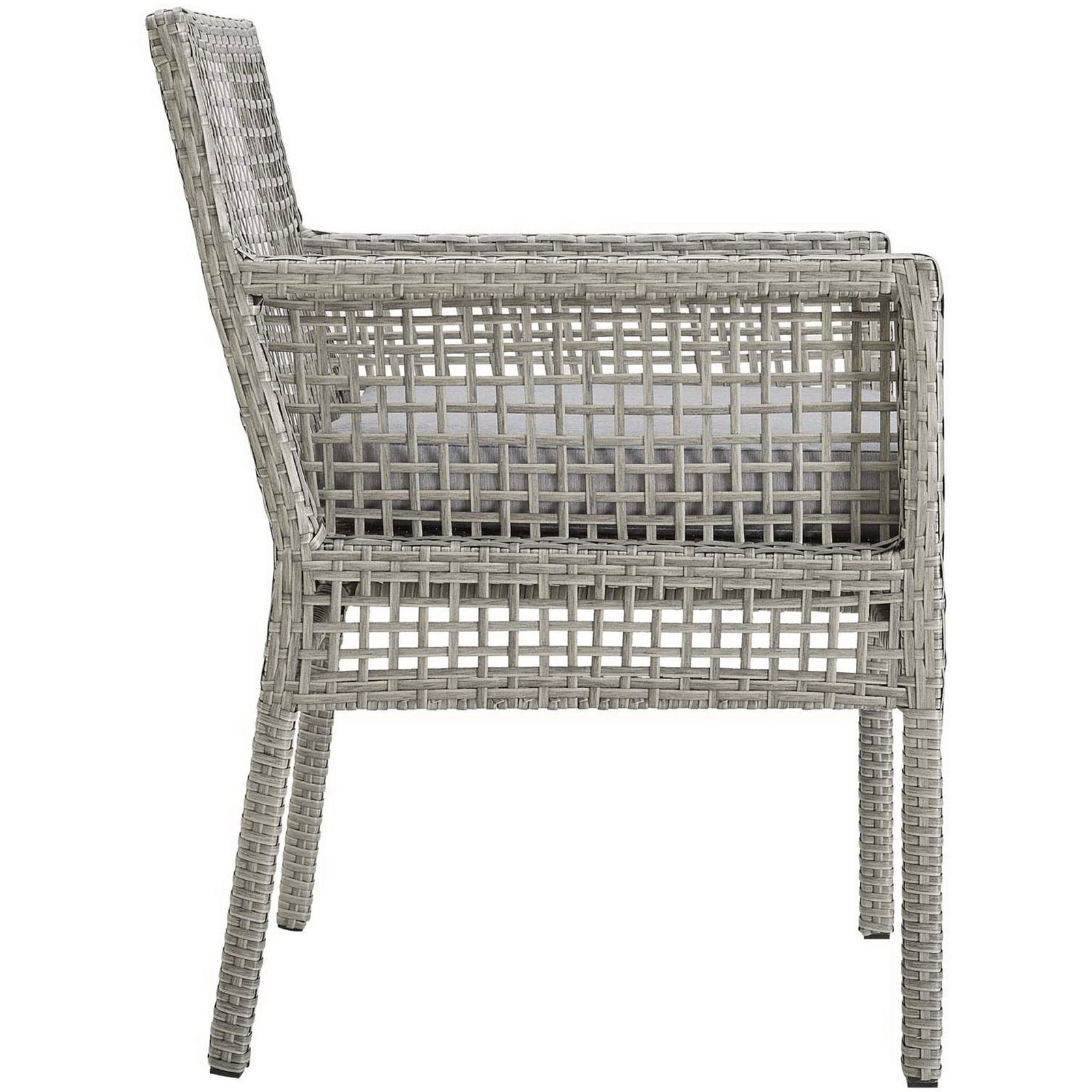 Slim gray wicker frame and square arms create a modern profile for this outdoor dining armchair with cushion || EEI-2920-GRY-GRY || side_studio