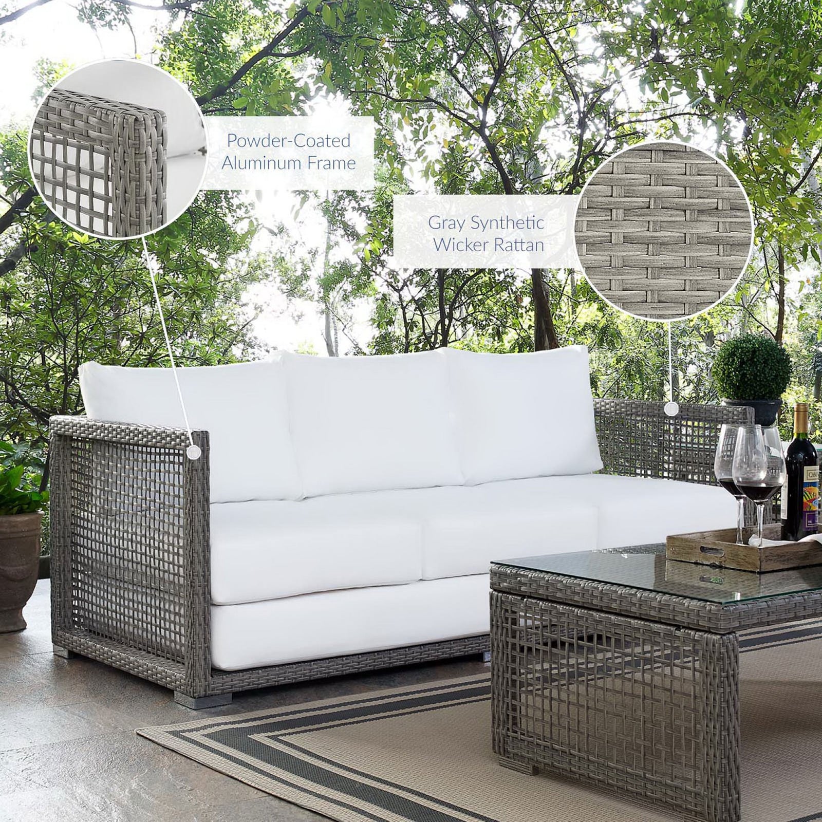 Outdoor setting featuring gray wicker sofa with white cushions and callouts for its frame and rattan weave || EEI-2923-GRY-WHI || callout_room