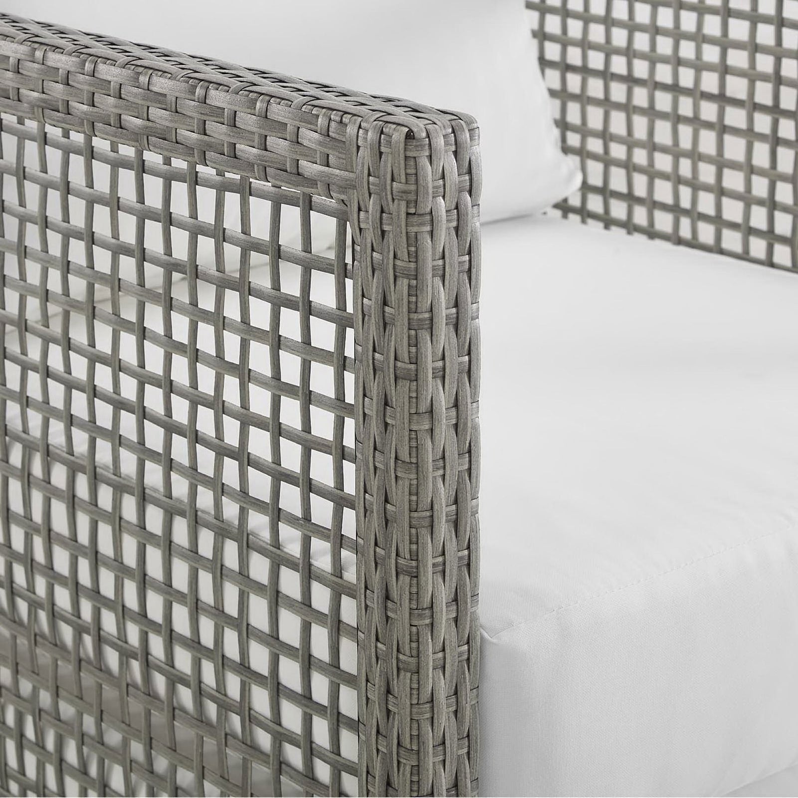Gray wicker arm detail with thick white cushion on Aura outdoor loveseat || EEI-2924-GRY-WHI || detail_studio