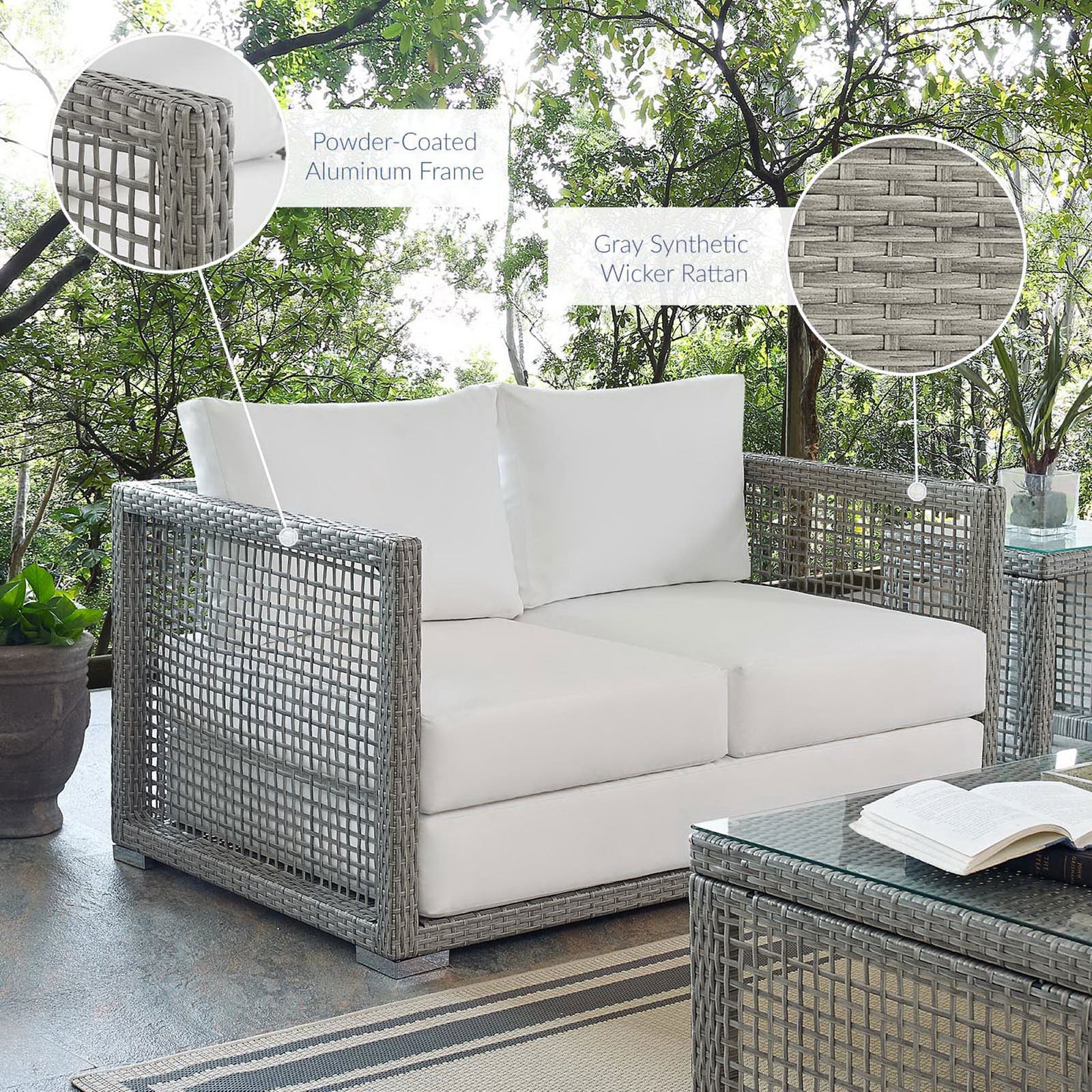 Aura gray wicker loveseat with white cushions on patio highlighting frame || EEI-2924-GRY-WHI || callout_room