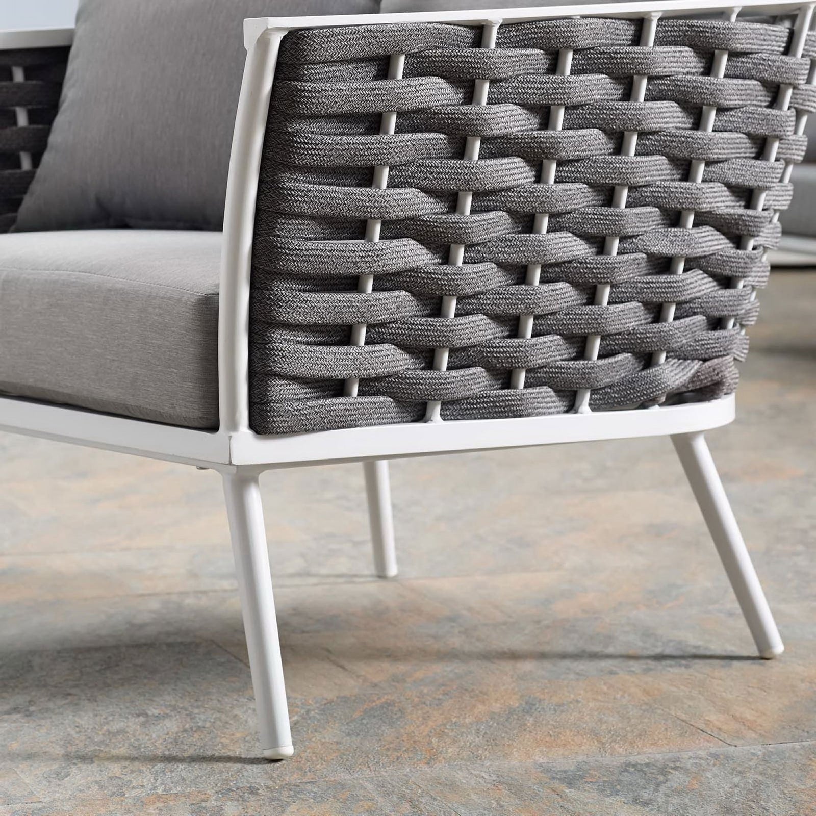 White tapered leg and woven rope texture of the Stance gray outdoor armchair on tile || EEI-3054-WHI-GRY || leg_room
