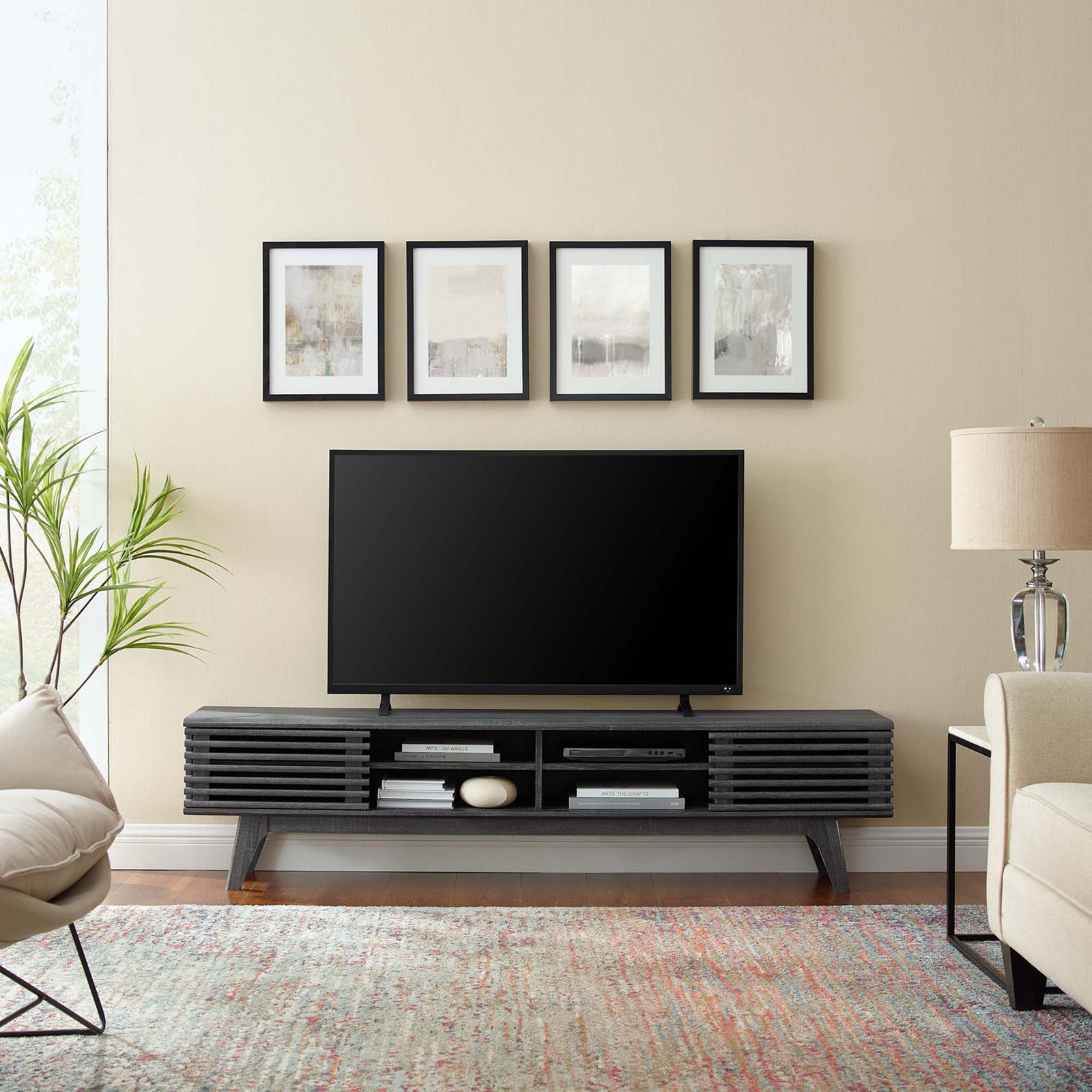 Charcoal Render TV stand styled in a modern living room with wall art, area rug, and coordinating seating || EEI-3303-CHA || front_room