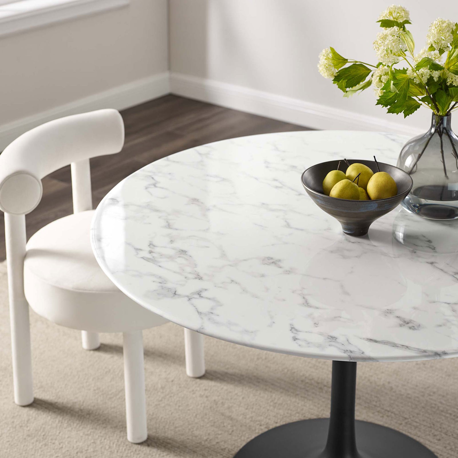 Close up of 48 inch faux marble tabletop arranged with a gray bowl and glass vase of green blooms || EEI-3527-BLK-WHI || detail_room
