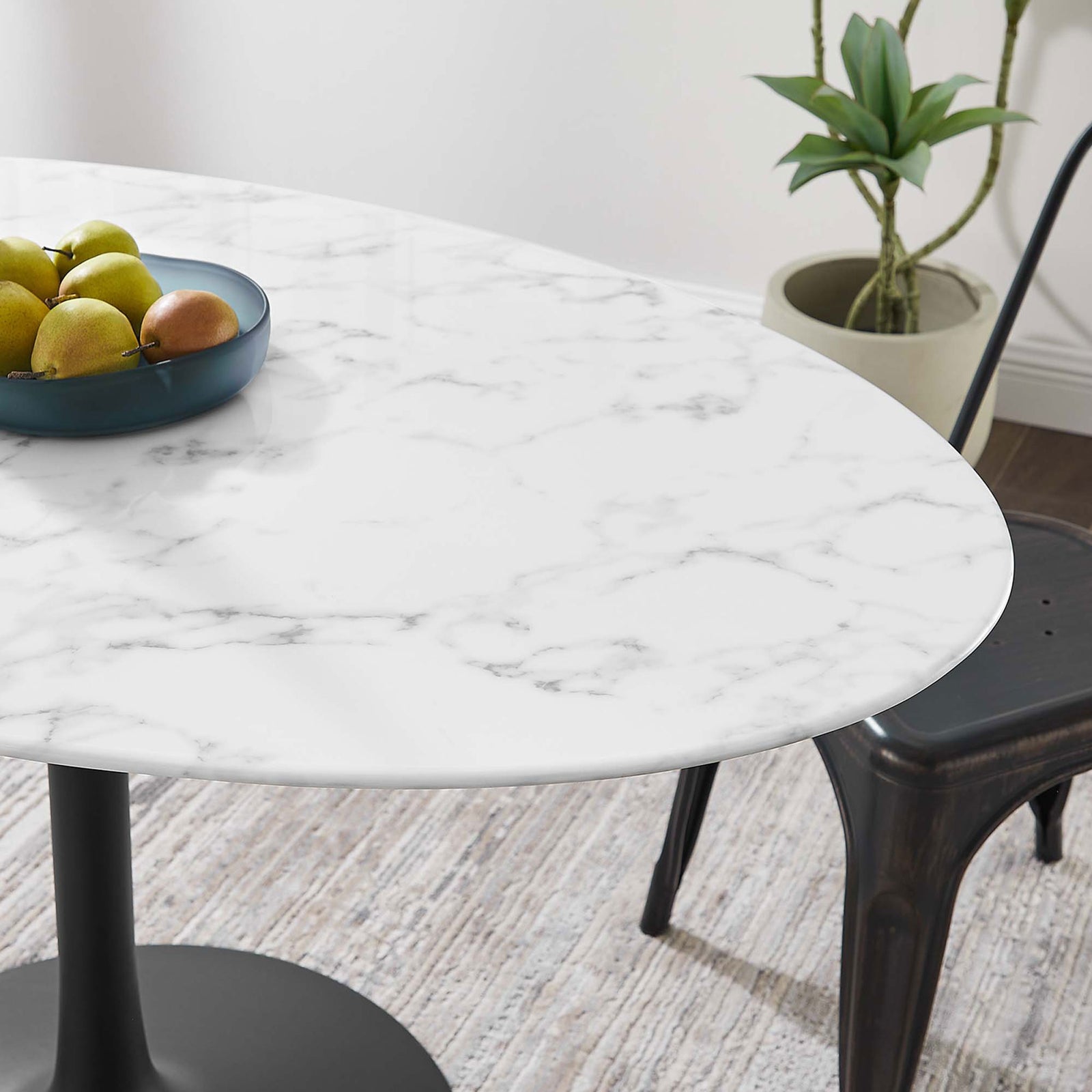 Smooth faux marble tabletop of the Lippa 54 inch table brings modern polish to a relaxed dining corner || EEI-3530-BLK-WHI || detail_room