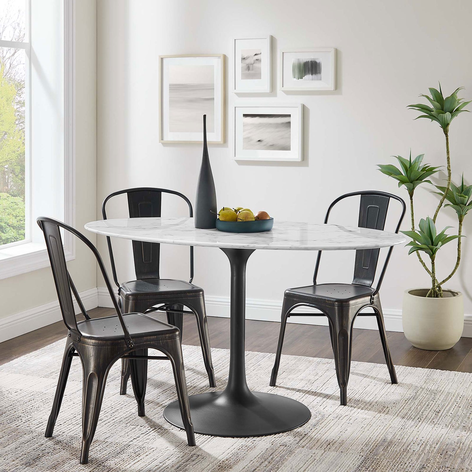 Lippa 54 inch oval faux marble dining table with black pedestal base anchors a bright contemporary dining space || EEI-3530-BLK-WHI || front_angle_room