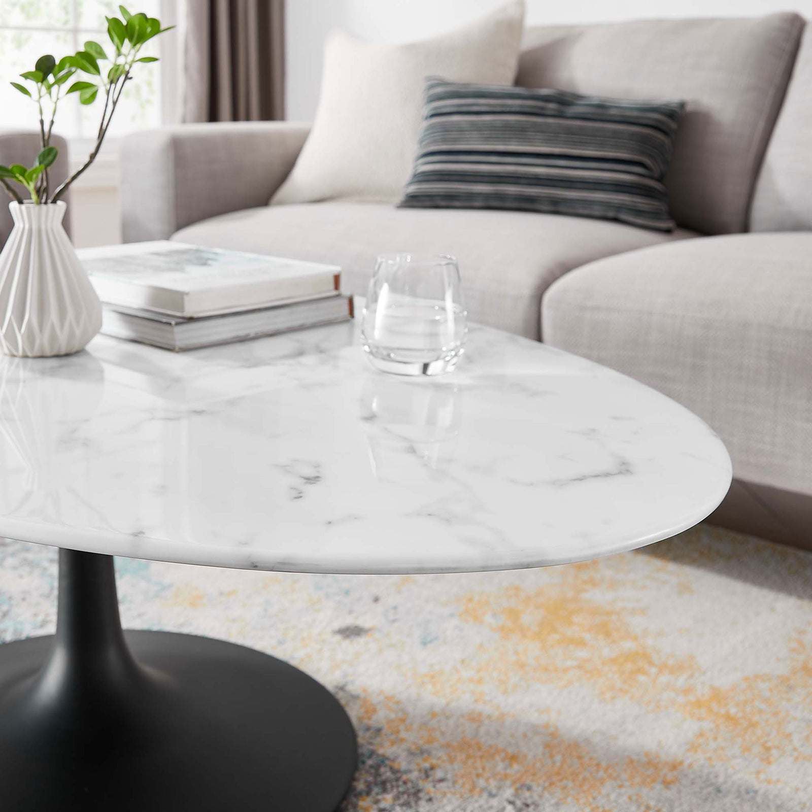 Beveled edge and smooth faux marble finish elevate everyday lounging with modern elegance || EEI-3537-BLK-WHI || detail_room