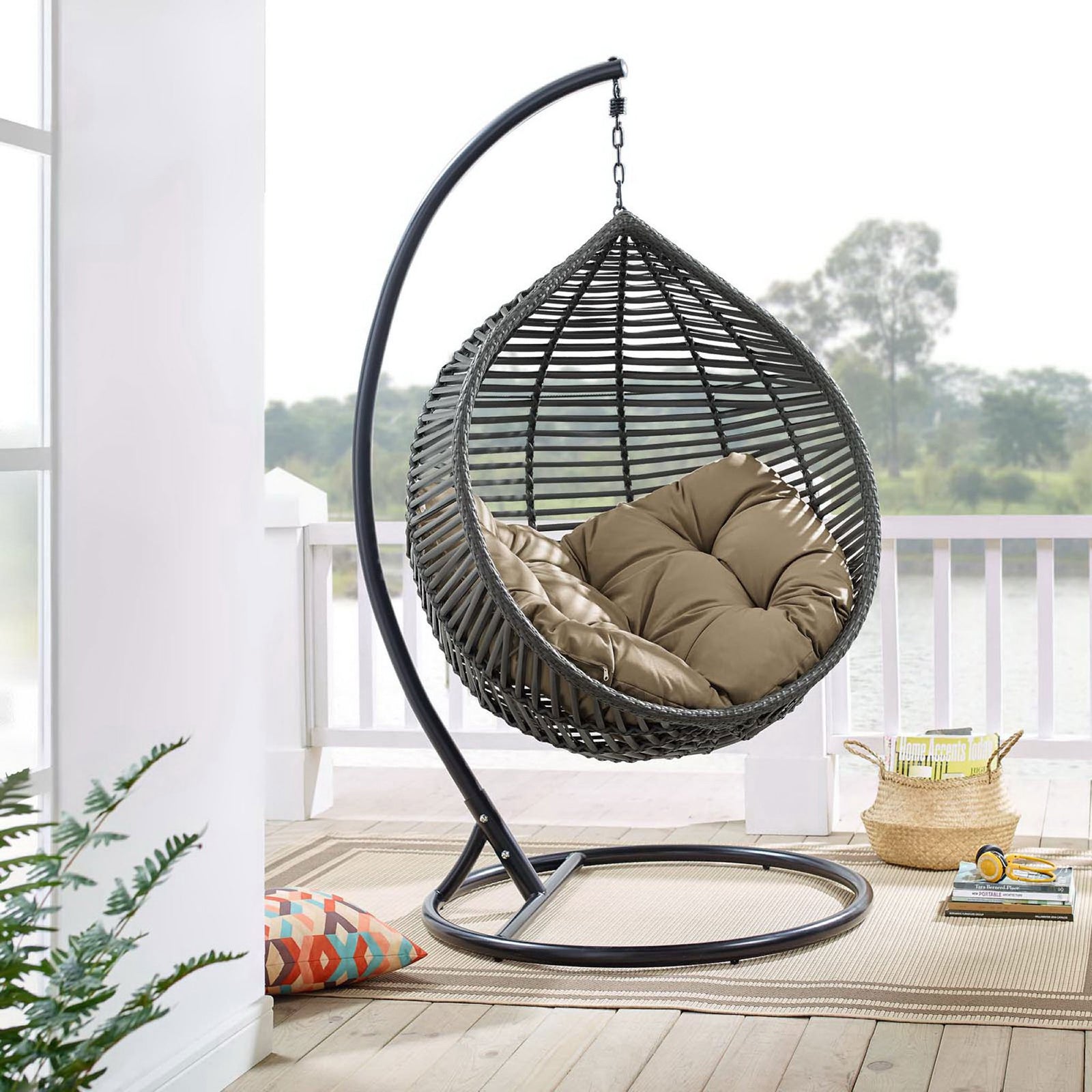 Teardrop swing chair with mocha cushion and steel stand creating a cozy corner on the porch. || EEI-3614-GRY-MOC || front_angle_room