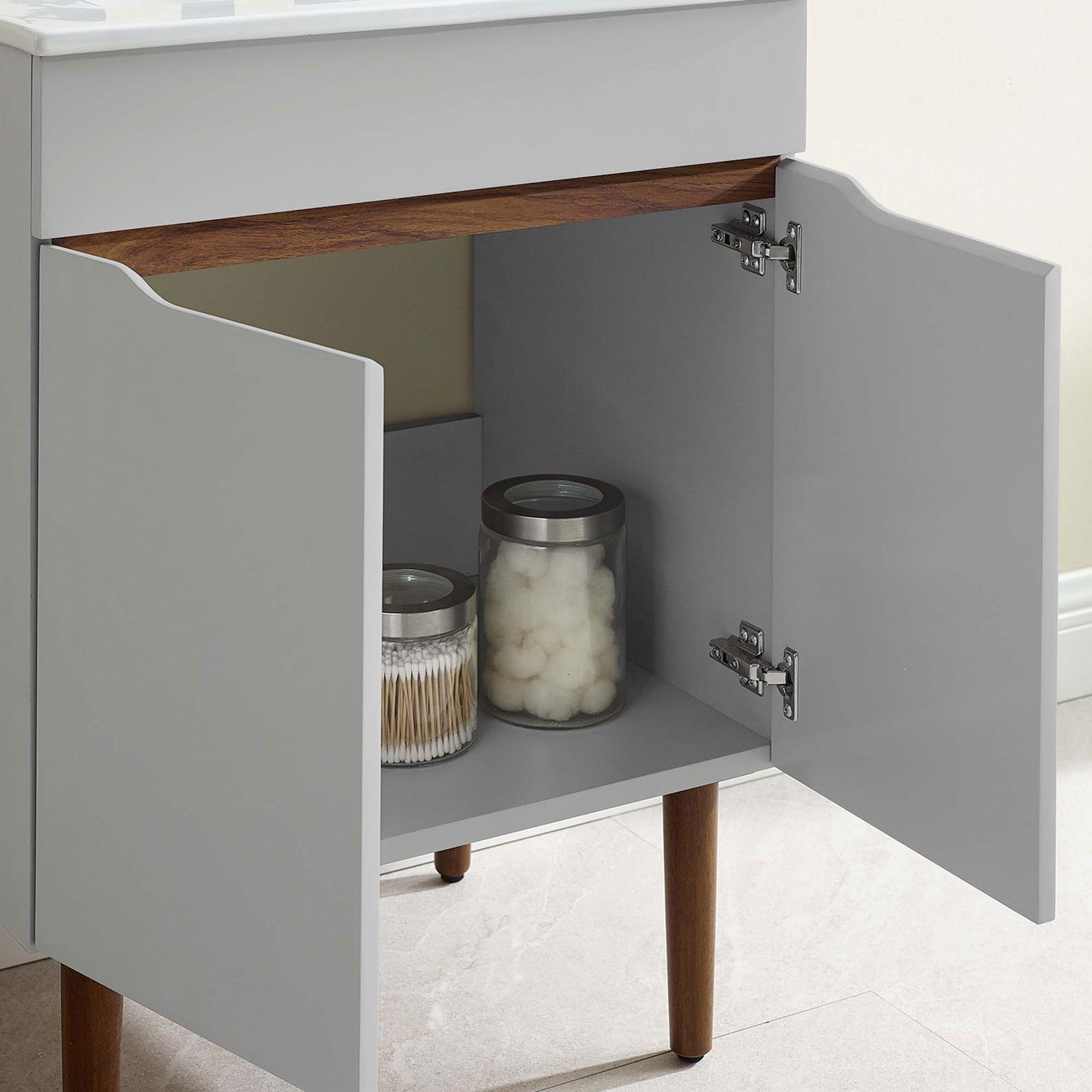 Cabinet interior fits everyday items neatly, with soft-close doors for quiet convenience || EEI-3633-GRY-WHI || storage_open_room