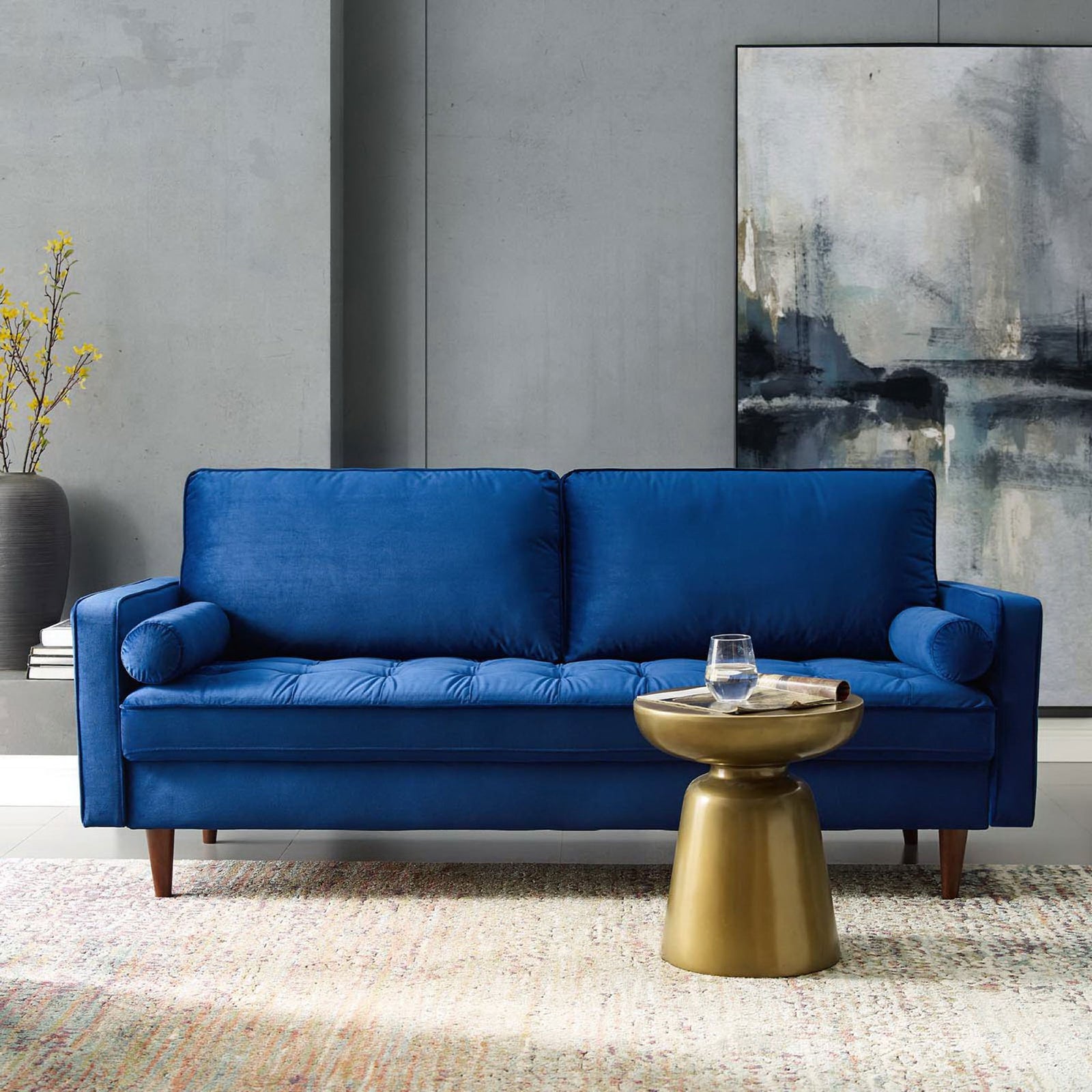 Navy velvet sofa styled in a modern living room with rug, accent table, and wall art || EEI-3764-NAV || front_room