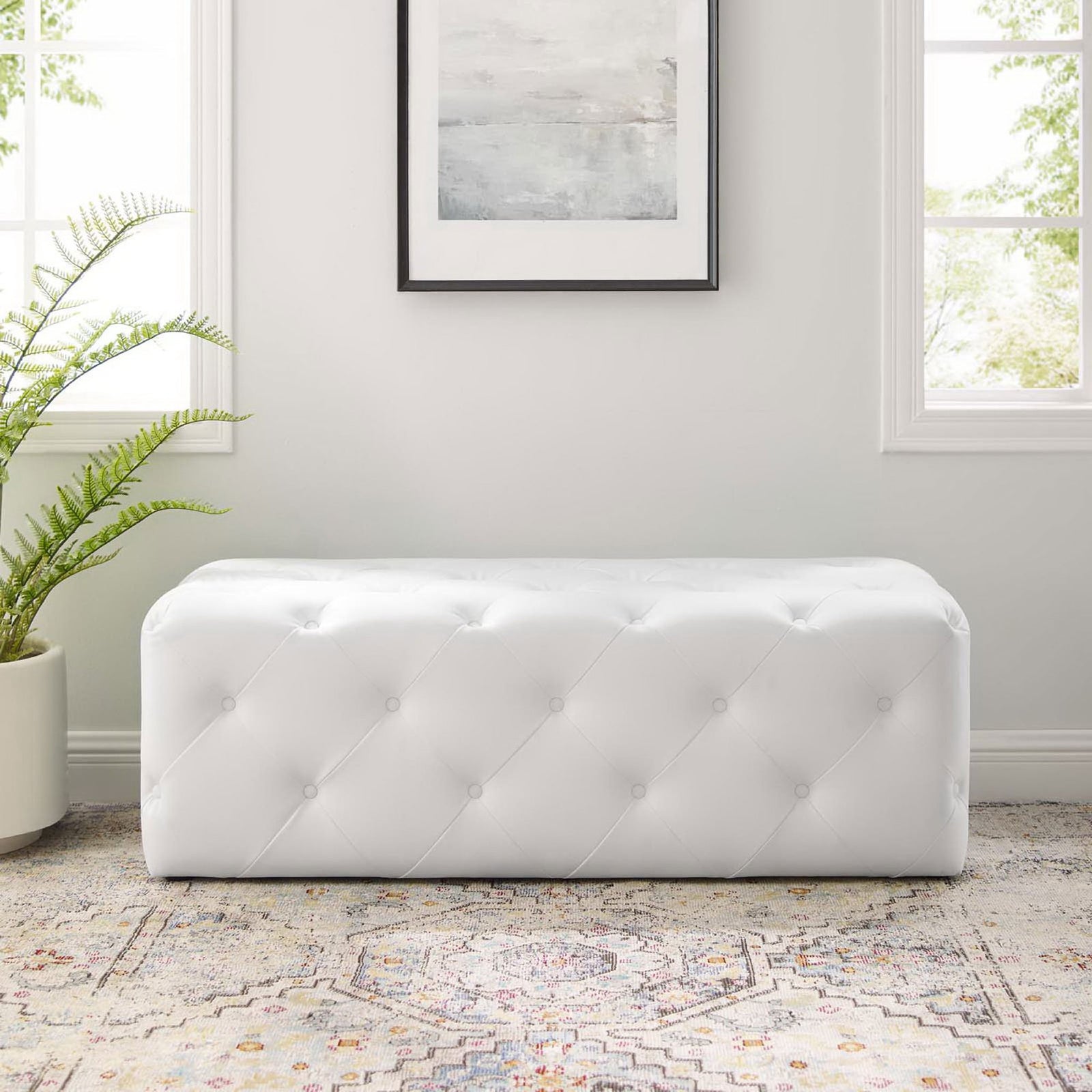 Sleek, low bench in bright white faux leather with symmetrical tufted patterning || EEI-3767-WHI || front_room